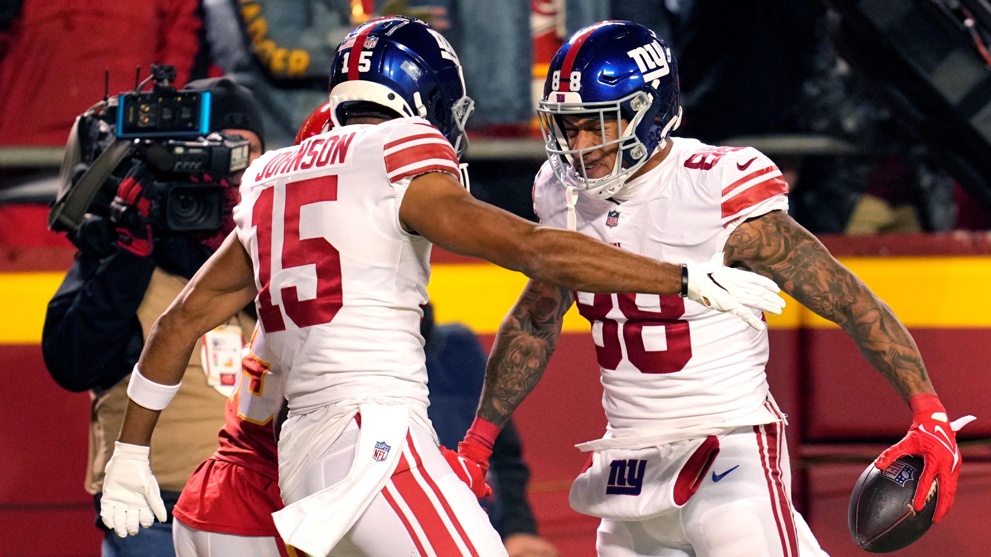 Nov 1, 2021; Kansas City, Missouri, USA; New York Giants tight end Evan Engram (88) celebrates with wide receiver Collin Johnson (15) after scoring a touchdown during the second half against the Kansas City Chiefs at GEHA Field at Arrowhead Stadium. Mandatory Credit: Jay Biggerstaff-USA TODAY Sports / Jay Biggerstaff-USA TODAY Sports