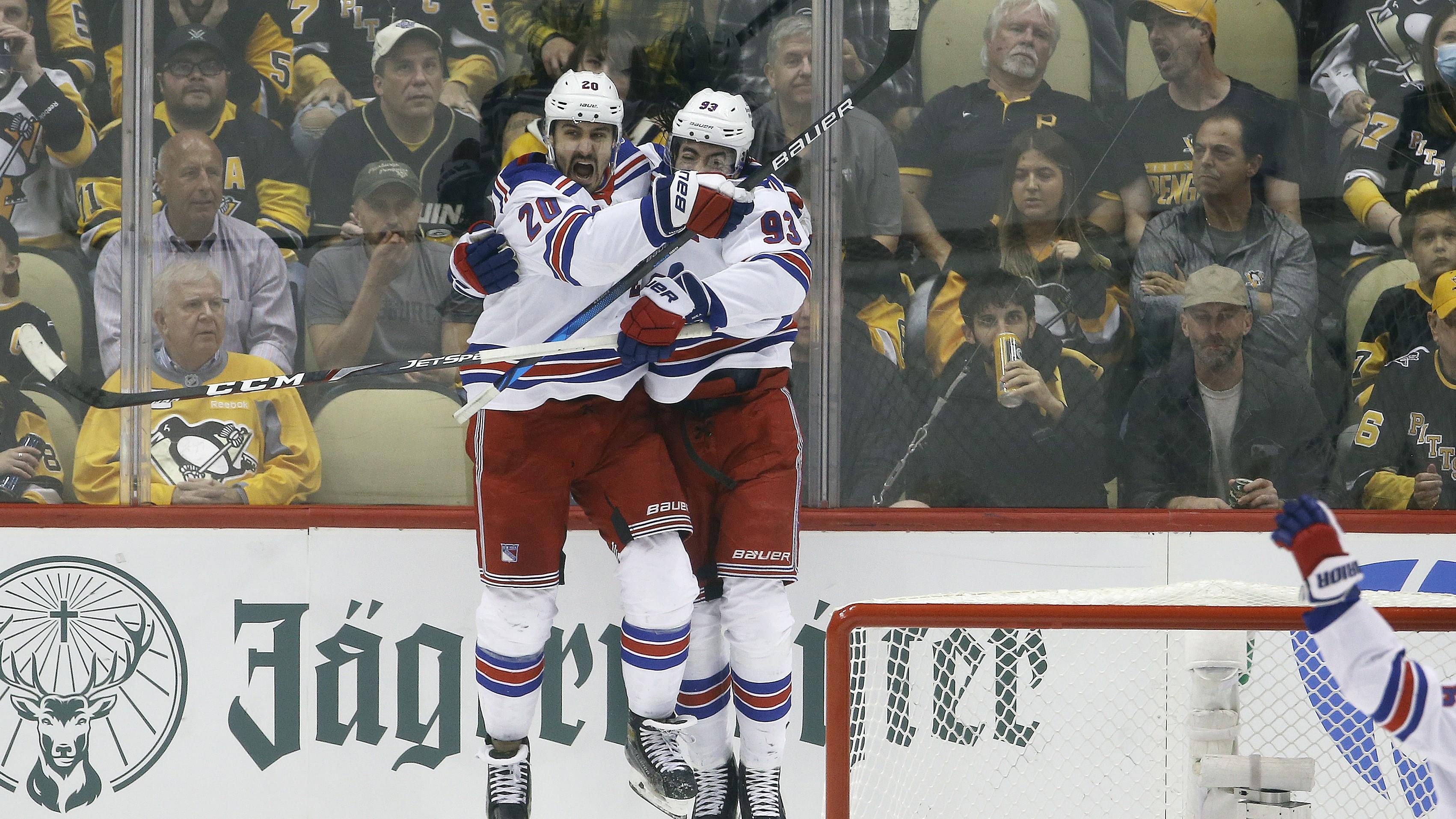 May 13, 2022; Pittsburgh, Pennsylvania, USA; New York Rangers left wing Chris Kreider (20) and center Mika Zibanejad (93) celebrate a goal by Kreider against Pittsburgh Penguins goaltender Louis Domingue (70) during the second period in game six of the first round of the 2022 Stanley Cup Playoffs at PPG Paints Arena. Mandatory Credit: Charles LeClaire-USA TODAY Sports / Charles LeClaire-USA TODAY Sports