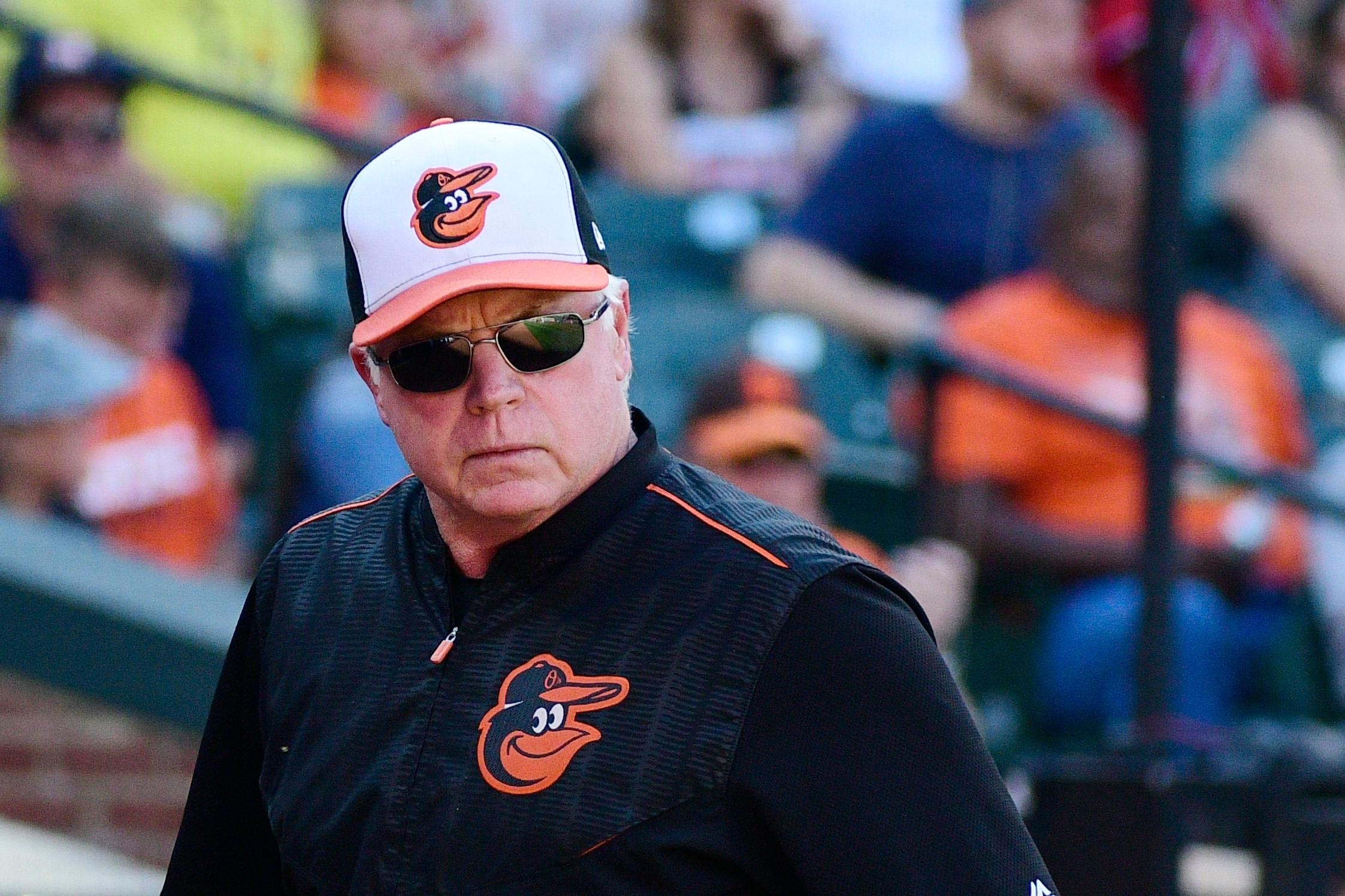 Baltimore Orioles manager Buck Showalter (26) walks off the field after speaking with an umpire in the third inning against the Houston Astros at Oriole Park at Camden Yards. / Tommy Gilligan/USA TODAY