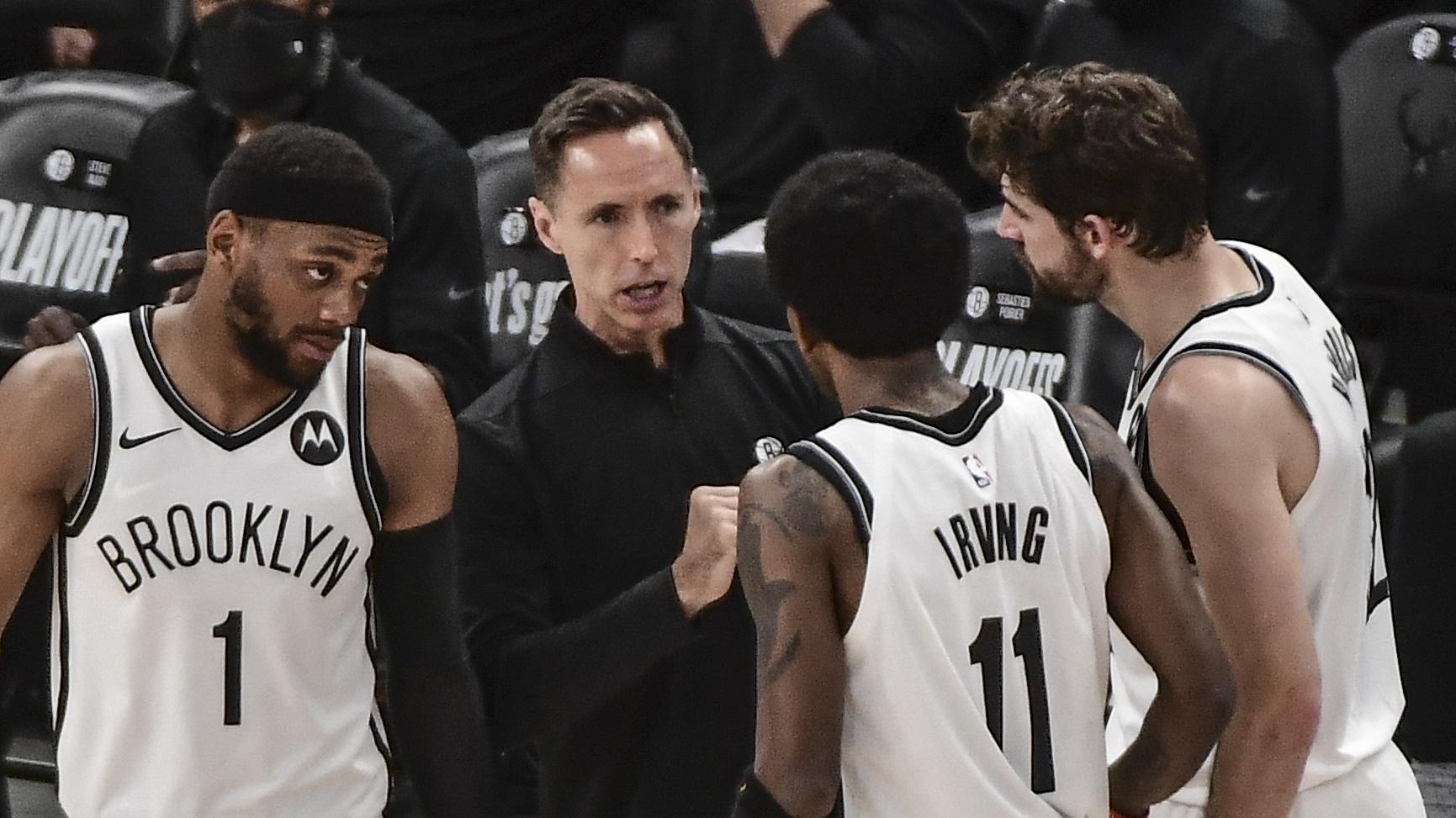 Jun 10, 2021; Milwaukee, Wisconsin, USA; Brooklyn Nets head coach Steve Nash sets up a play with forward Bruce Brown (1) and guard Kyrie Irving (11) in the second quarter against the Milwaukee Bucks during game three in the second round of the 2021 NBA Playoffs at Fiserv Forum. Mandatory Credit: Benny Sieu-USA TODAY Sports / © Benny Sieu-USA TODAY Sports