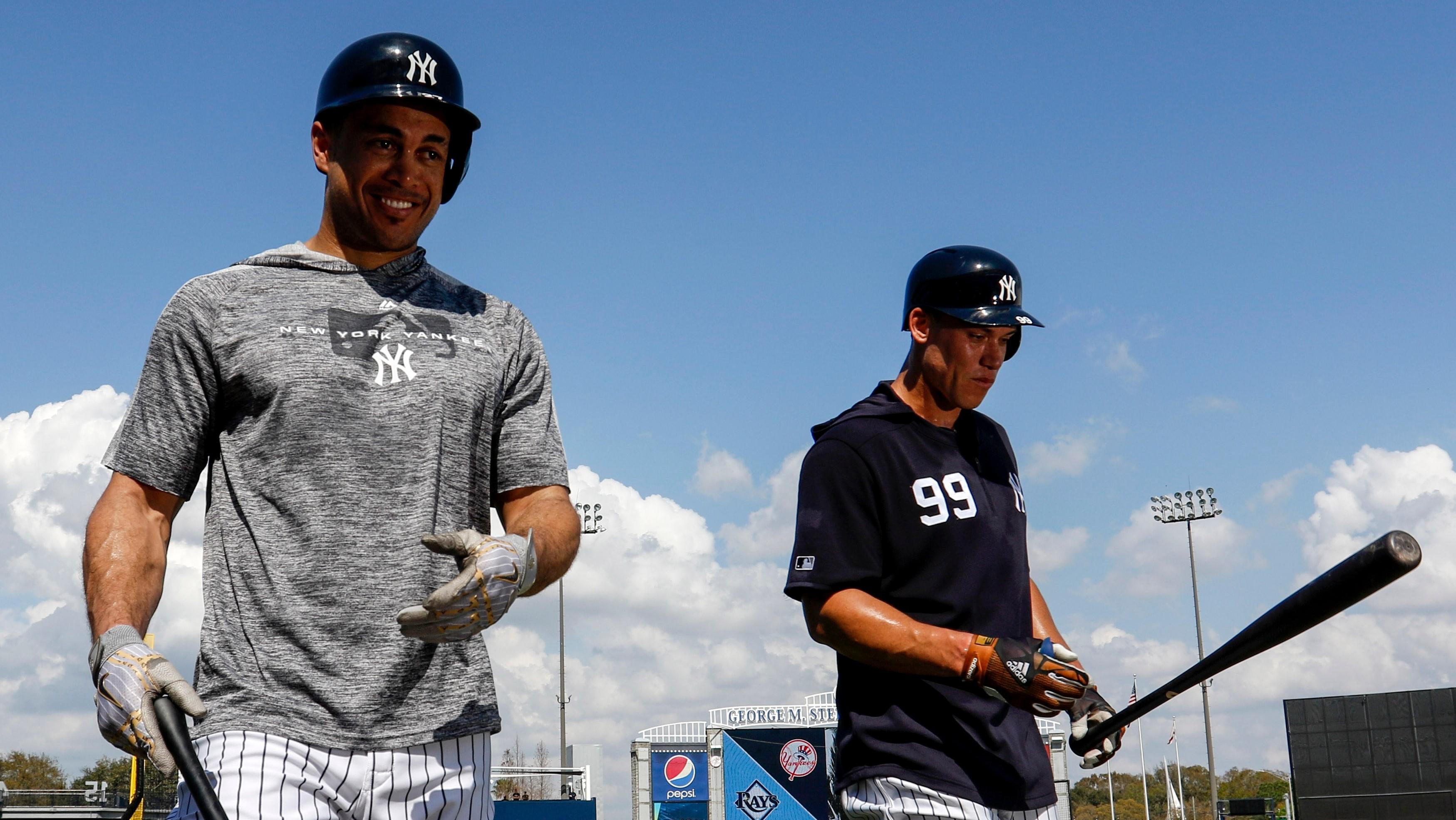 Feb 19, 2019; Tampa, FL, USA; New York Yankees left fielder Giancarlo Stanton (27) and right fielder Aaron Judge (99) walk off the field after batting practice during spring training at George M. Steinbrenner Field. Mandatory Credit: Butch Dill-USA TODAY Sports / © Butch Dill-USA TODAY Sports