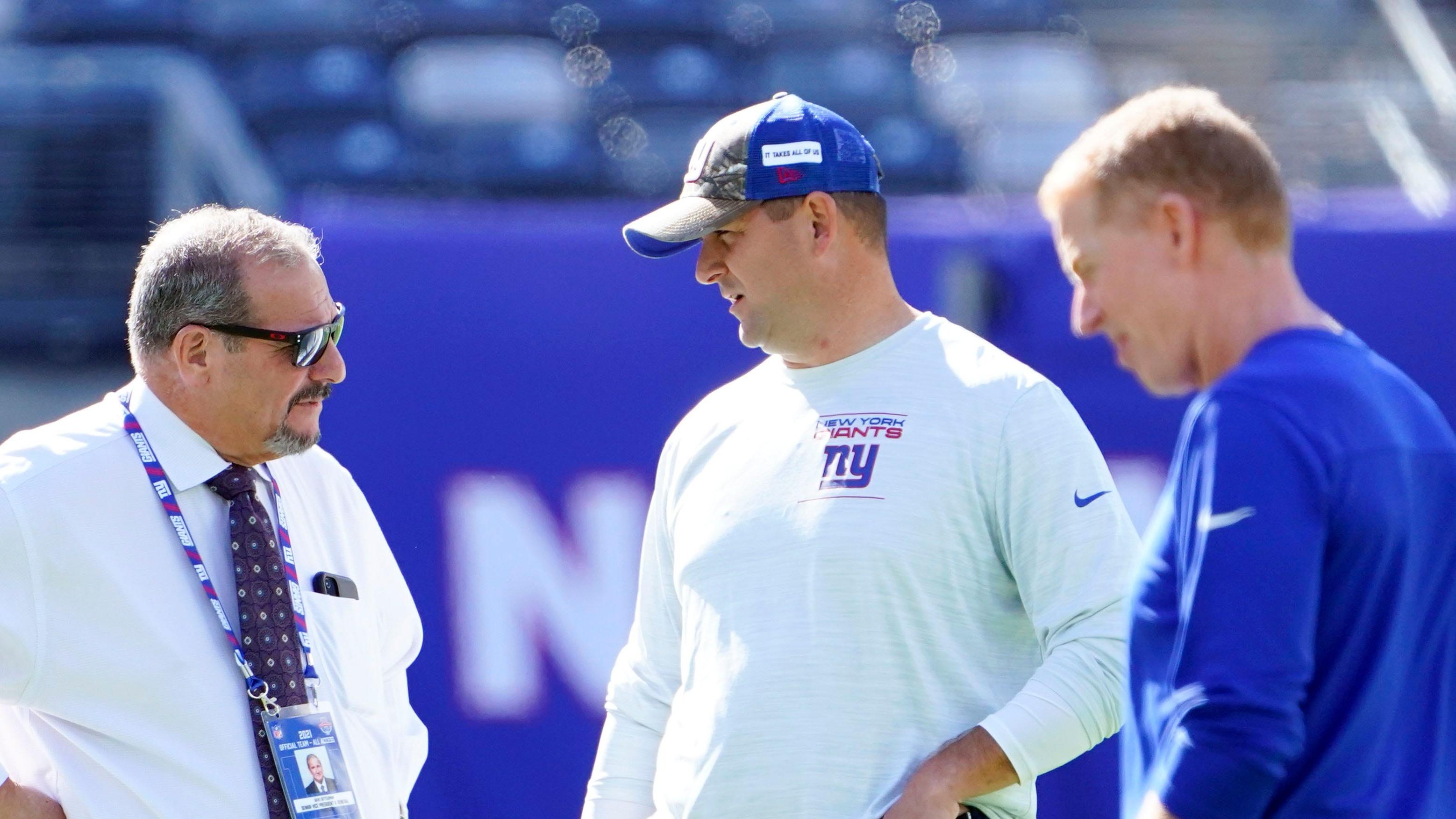 (from left) New York Giants general manager Dave Gettleman, head coach Joe Judge, and offensive coordinator Jason Garrett on the field before the game at MetLife Stadium on Sunday, Sept. 26, 2021, in East Rutherford. / © Danielle Parhizkaran/NorthJersey.com via Imagn Content Services, LLC