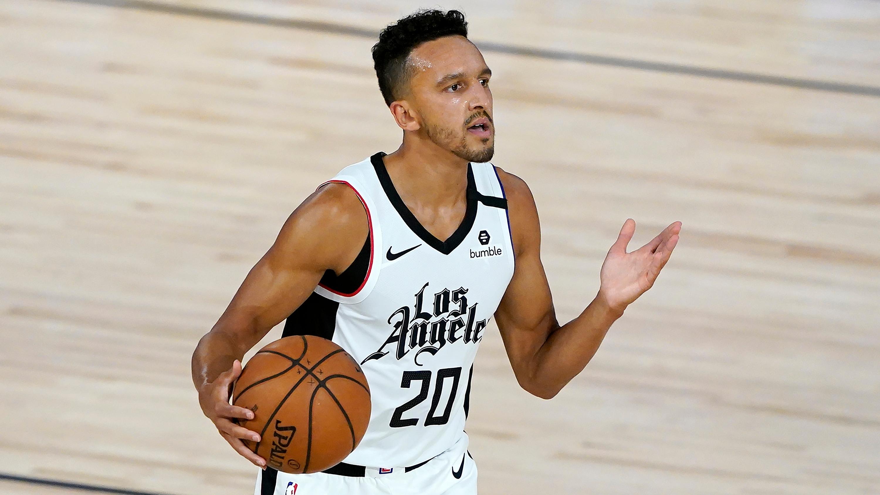 Aug 6, 2020; Lake Buena Vista, Florida, USA; Los Angeles Clippers' Landry Shamet (20) eyes a teammate as he dribbles up court against the Dallas Mavericks during the first half of an NBA basketball game Thursday, Aug. 6, 2020 in Lake Buena Vista, Fla. at HP Field House. / Pool Photo-USA TODAY Sports