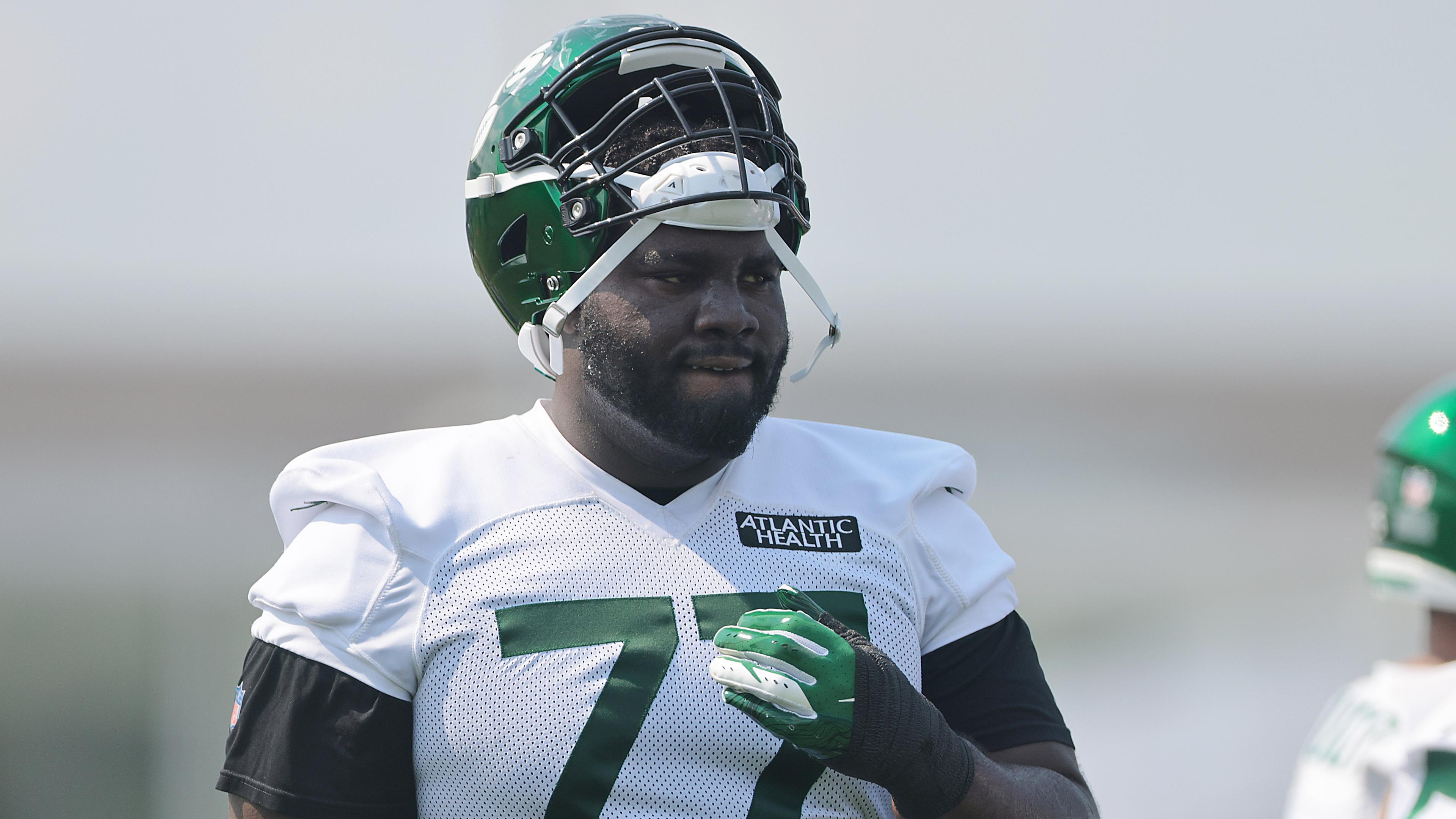 New York Jets offensive tackle Mekhi Becton (77) looks on during training camp at Atlantic Health Jets Training Center. / Vincent Carchietta-USA TODAY Sports