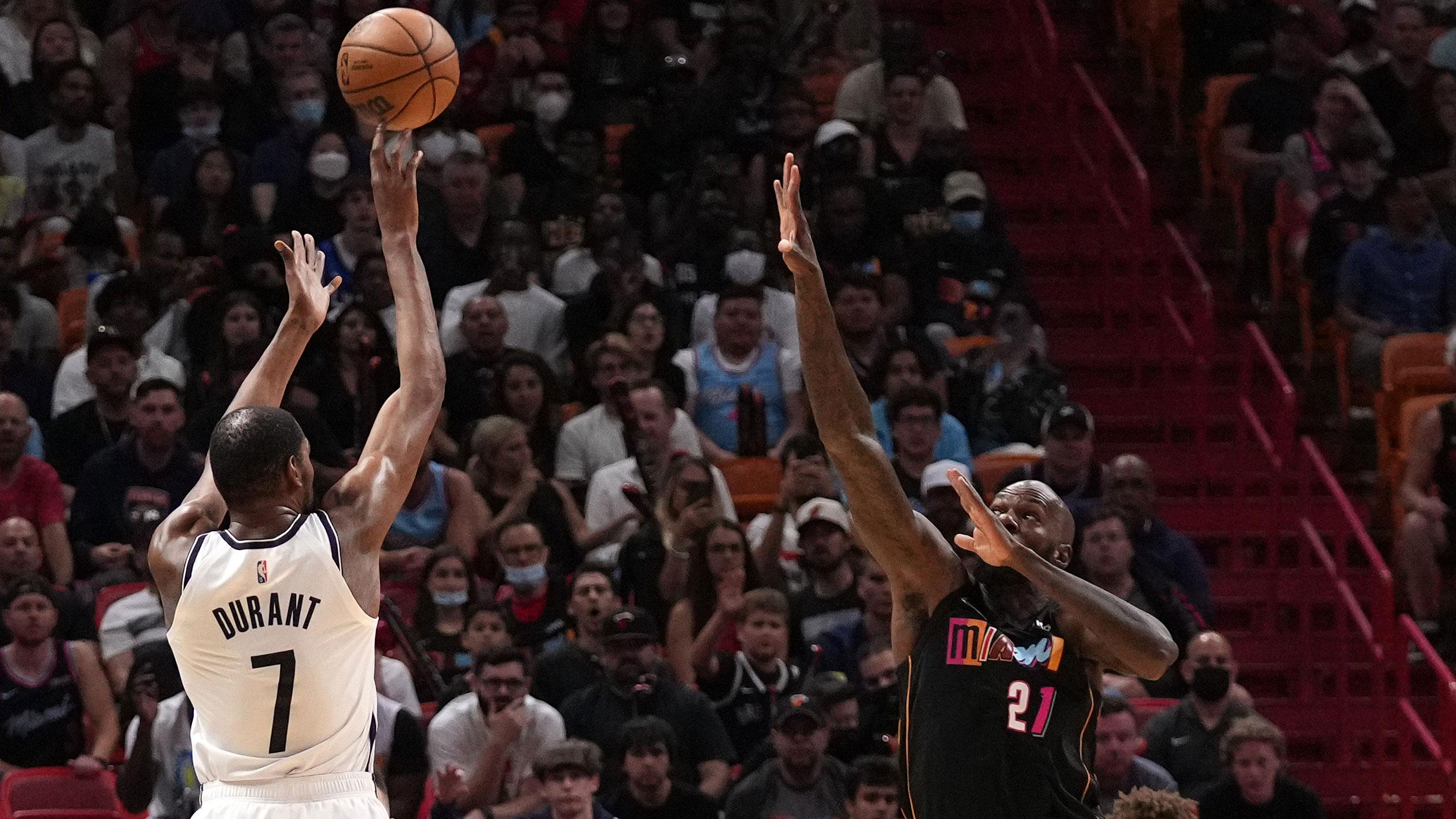 Mar 26, 2022; Miami, Florida, USA; Brooklyn Nets forward Kevin Durant (7) shoots over Miami Heat center Dewayne Dedmon (21) during the first half at FTX Arena. / Jasen Vinlove-USA TODAY Sports