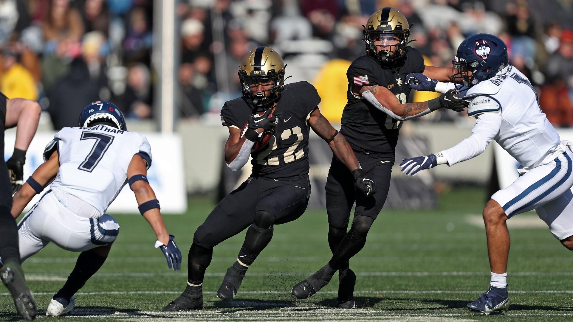 Nov 19, 2022; West Point, New York, USA; Army Black Knights running back Miles Stewart (22) carries the ball against the Connecticut Huskies during the first half at Michie Stadium. / Danny Wild-USA TODAY Sports