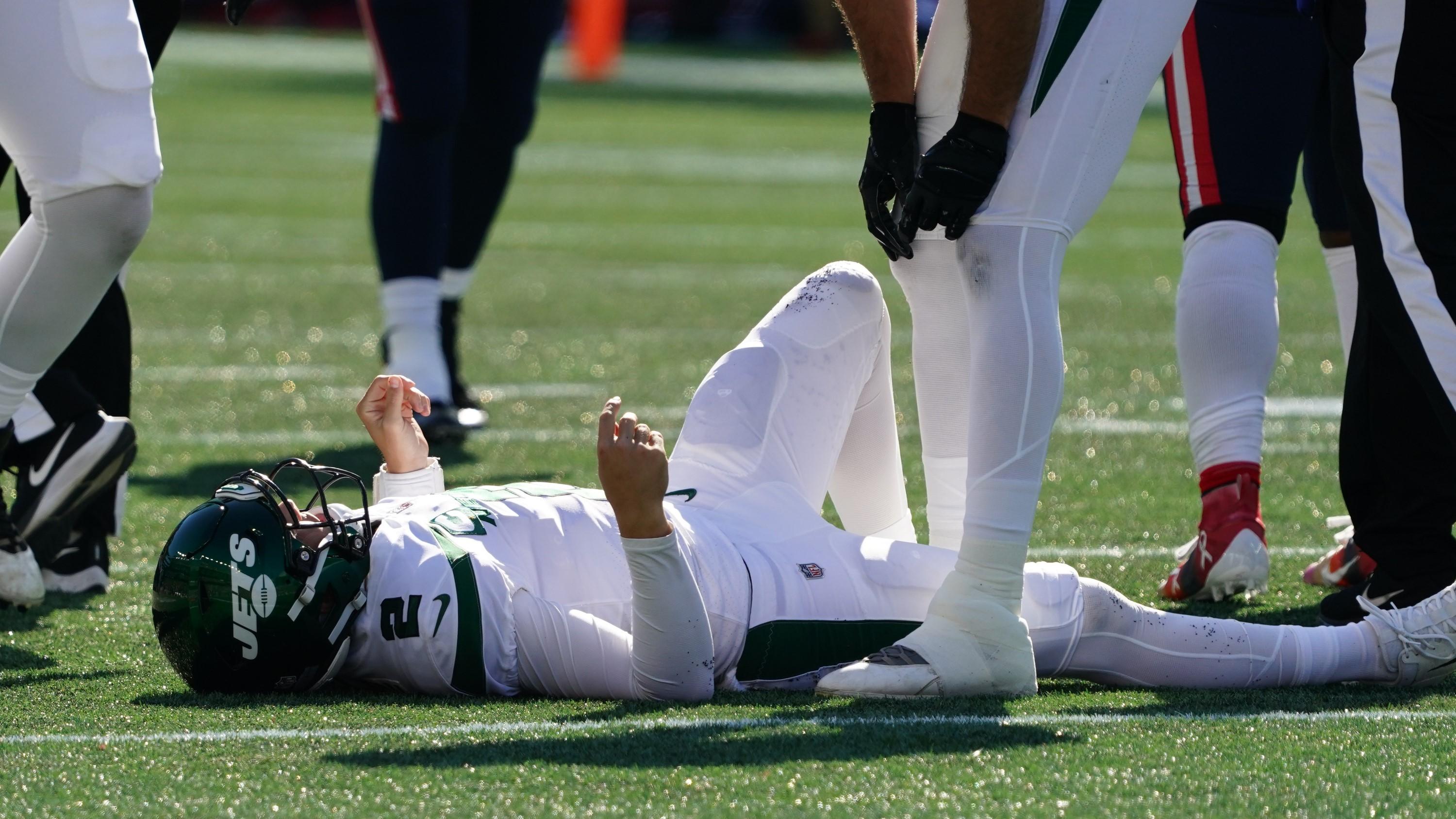 Oct 24, 2021; Foxborough, Massachusetts, USA; New York Jets quarterback Zach Wilson (2) on the ground injured against the New England Patriots in the second quarter at Gillette Stadium. Mandatory Credit: David Butler II-USA TODAY Sports / David Butler II-USA TODAY Sports