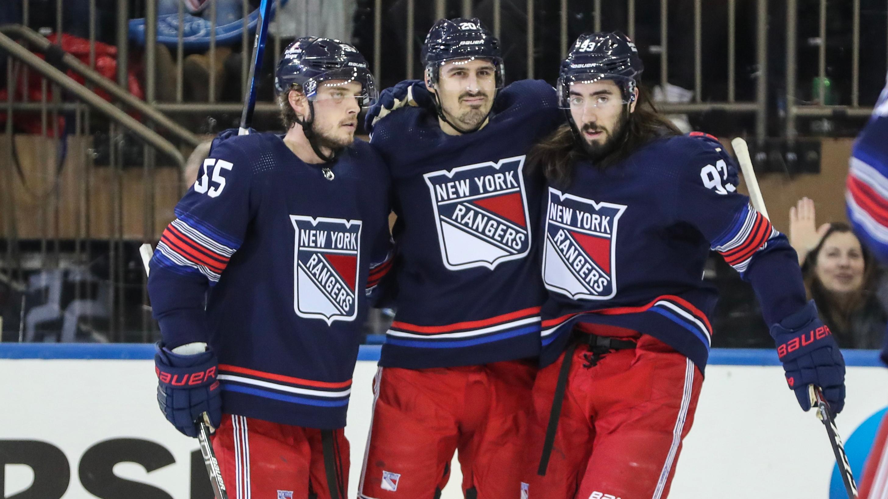 New York Rangers left wing Chris Kreider (20) is greeted by defenseman Ryan Lindgren (55) and center Mika Zibanejad (93) after scoring a goal in the first period against the Anaheim Ducks at Madison Square Garden. / Wendell Cruz-USA TODAY Sports