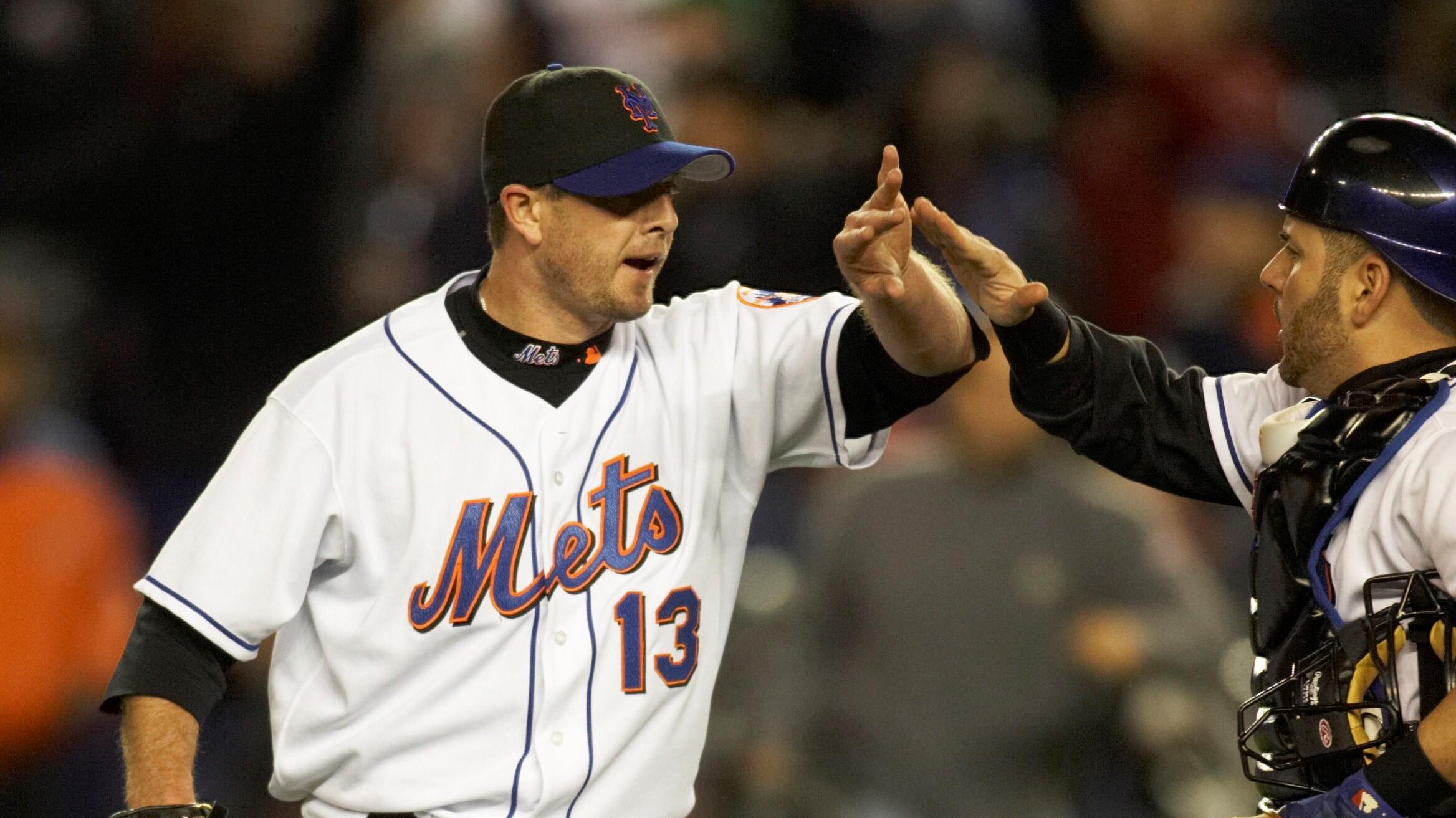 Oct 12, 2006; Flushing, NY, USA; New York Mets pitcher (13) Billy Wagner celebrates with catcher (16) Paul Lo Duca after recording the last out of game one of the National League Championship Series against the St. Louis Cardinals at Shea Stadium in Flushing, NY. The Mets defeated the Cardinals 2-0. Mandatory Credit: Howard Smith-USA TODAY Sports Copyright © 2006 Howard Smith / Howard Smith-USA TODAY Sports