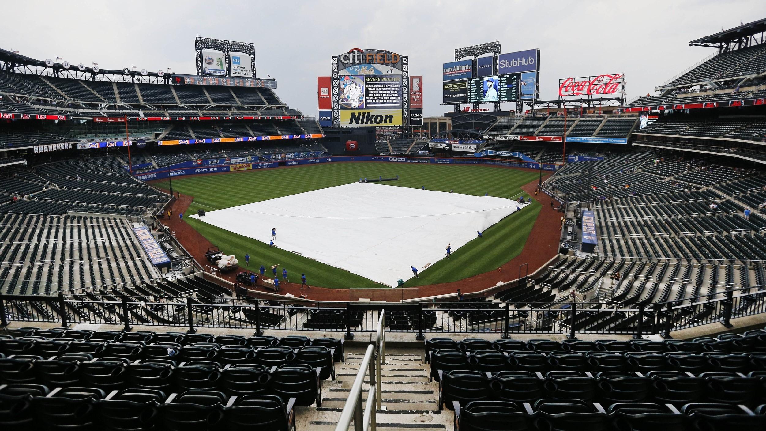 Jul 6, 2021; New York City, New York, USA; A general view with the tarp on the field prior to the game between the Milwaukee Brewers and the New York Mets at Citi Field. / Andy Marlin-USA TODAY Sports