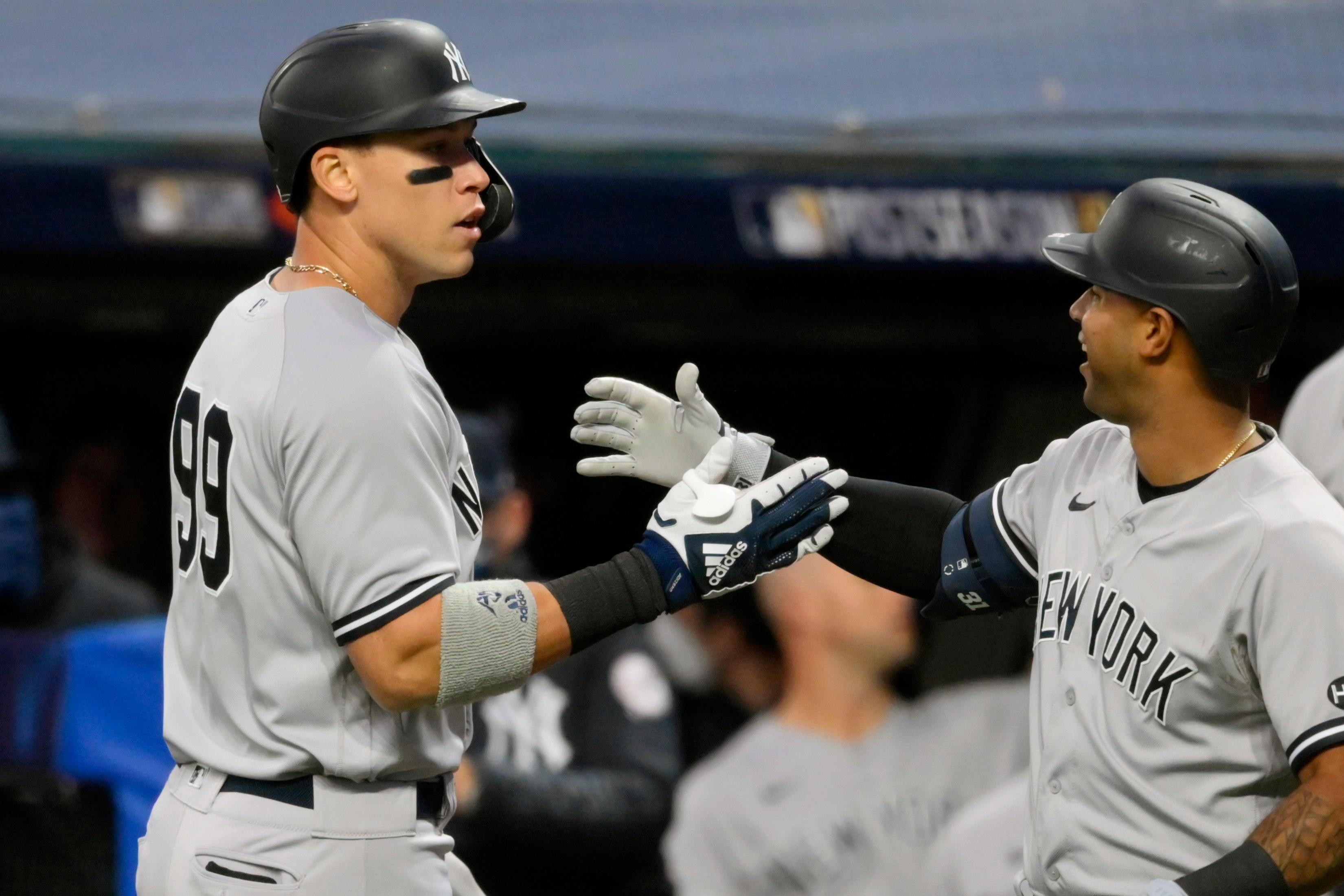 Sep 29, 2020; Cleveland, Ohio, USA; New York Yankees right fielder Aaron Judge (99) celebrates with center fielder Aaron Hicks (right) after hitting a two-run home run against the Cleveland Indians in the first inning at Progressive Field. Mandatory Credit: David Richard-USA TODAY Sports / © David Richard-USA TODAY Sports