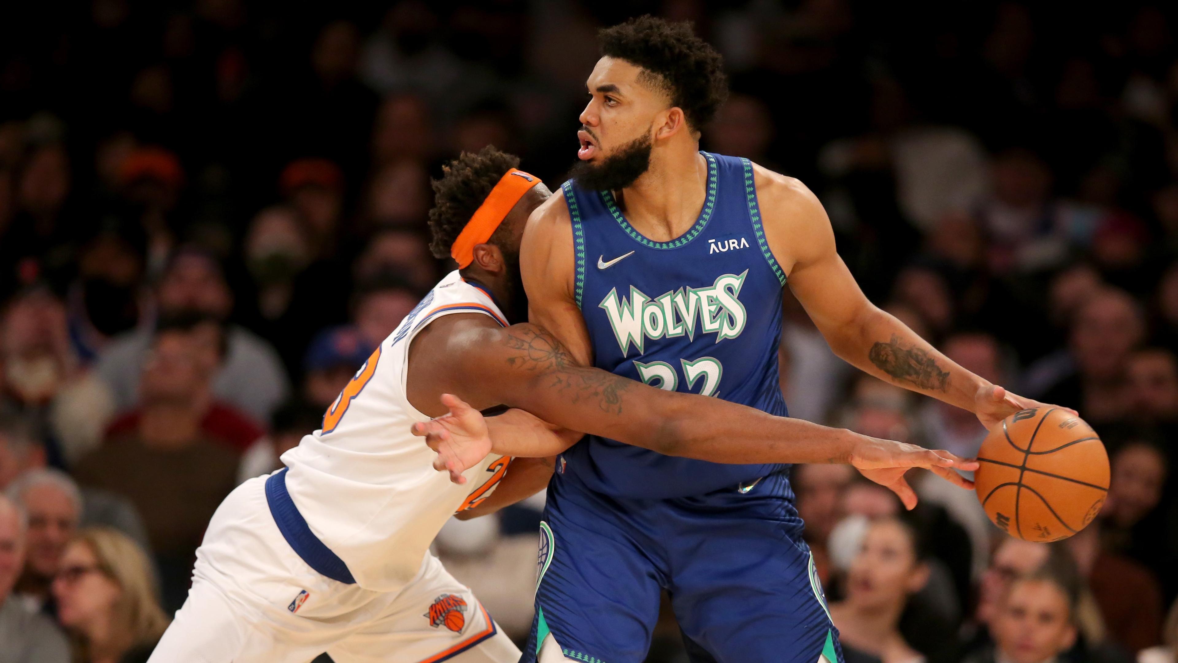 Jan 18, 2022; New York, New York, USA; New York Knicks center Mitchell Robinson (23) knocks the ball away from Minnesota Timberwolves center Karl-Anthony Towns (32) during the third quarter at Madison Square Garden. Mandatory Credit: Brad Penner-USA TODAY Sports / © Brad Penner-USA TODAY Sports