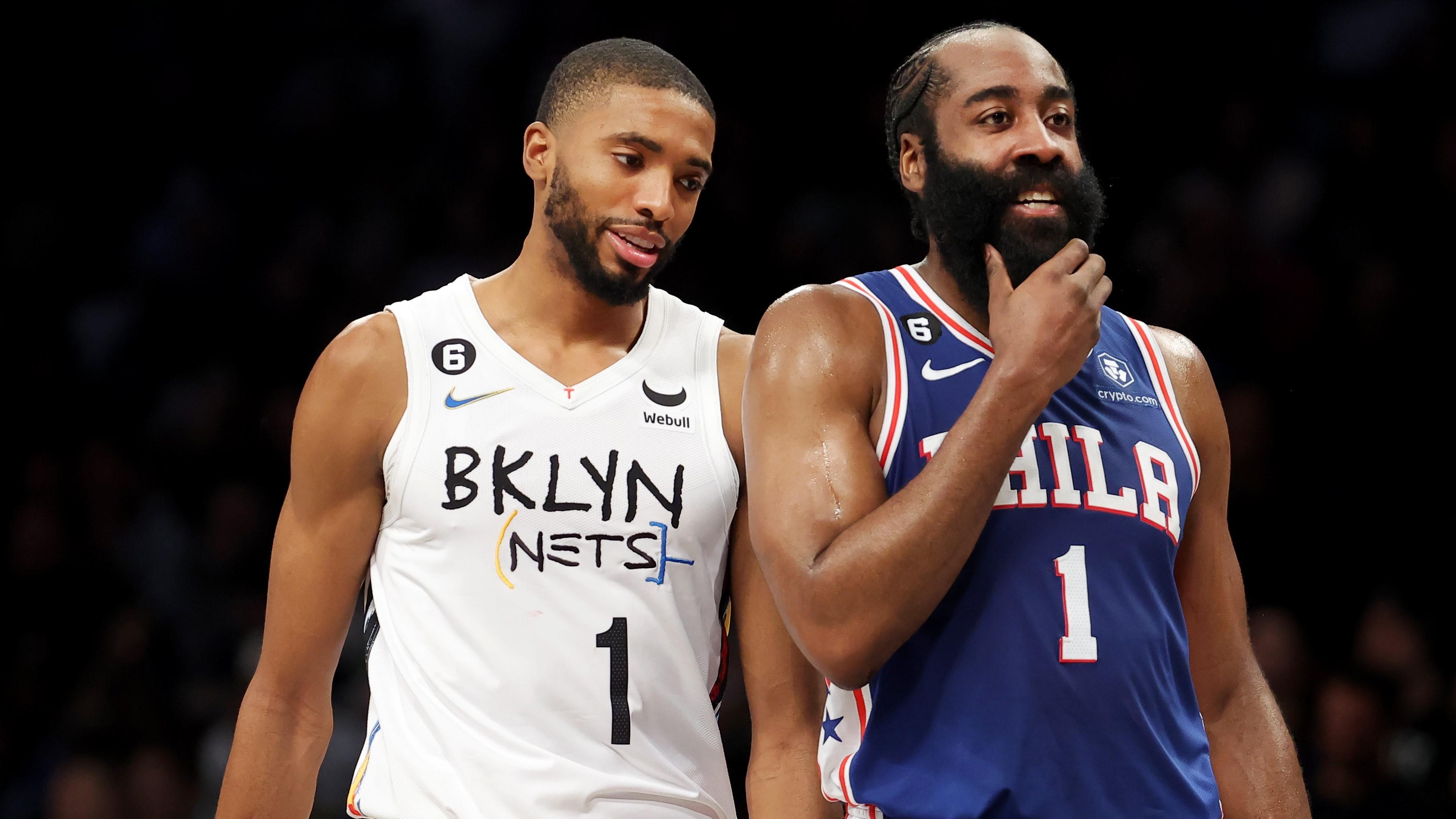 Feb 11, 2023; Brooklyn, New York, USA; Brooklyn Nets forward Mikal Bridges (1) talks to Philadelphia 76ers guard James Harden (1) during a time out during the third quarter at Barclays Center. Mandatory Credit: Brad Penner-USA TODAY Sports / © Brad Penner-USA TODAY Sports