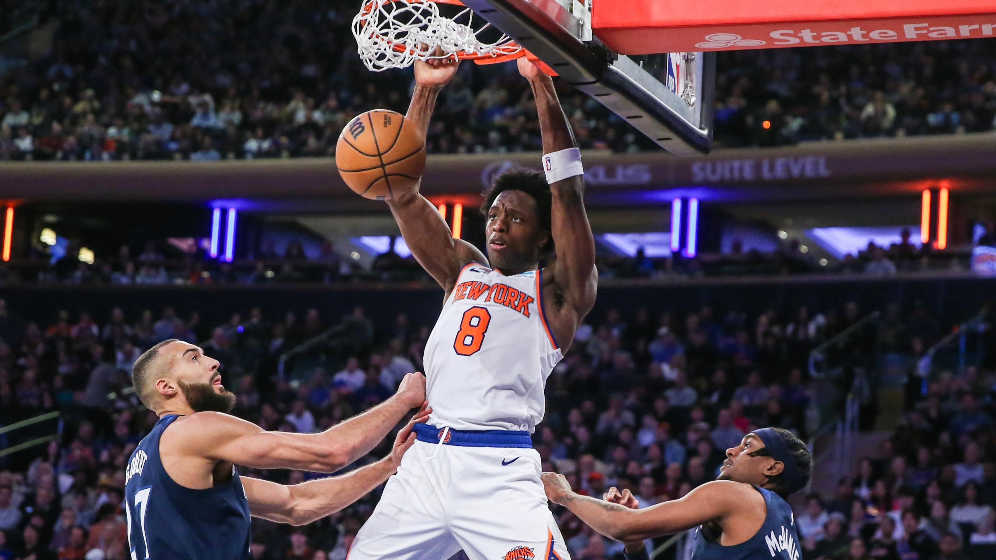 New York Knicks forward OG Anunoby (8) dunks past Minnesota Timberwolves center Rudy Gobert (27) in the third quarter at Madison Square Garden. / Wendell Cruz-USA TODAY Sports