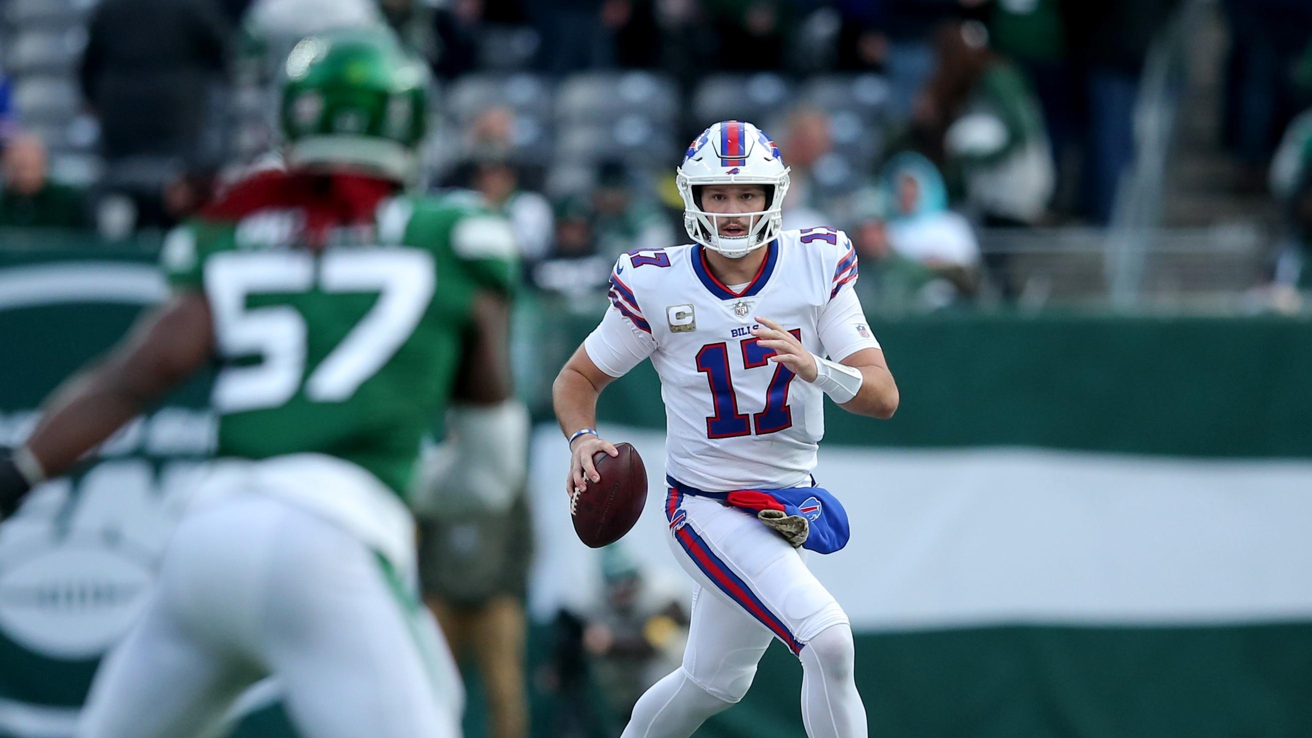 Nov 14, 2021; East Rutherford, New Jersey, USA; Buffalo Bills quarterback Josh Allen (17) runs with the ball against the New York Jets during the third quarter at MetLife Stadium. Mandatory Credit: Brad Penner-USA TODAY Sports / © Brad Penner-USA TODAY Sports