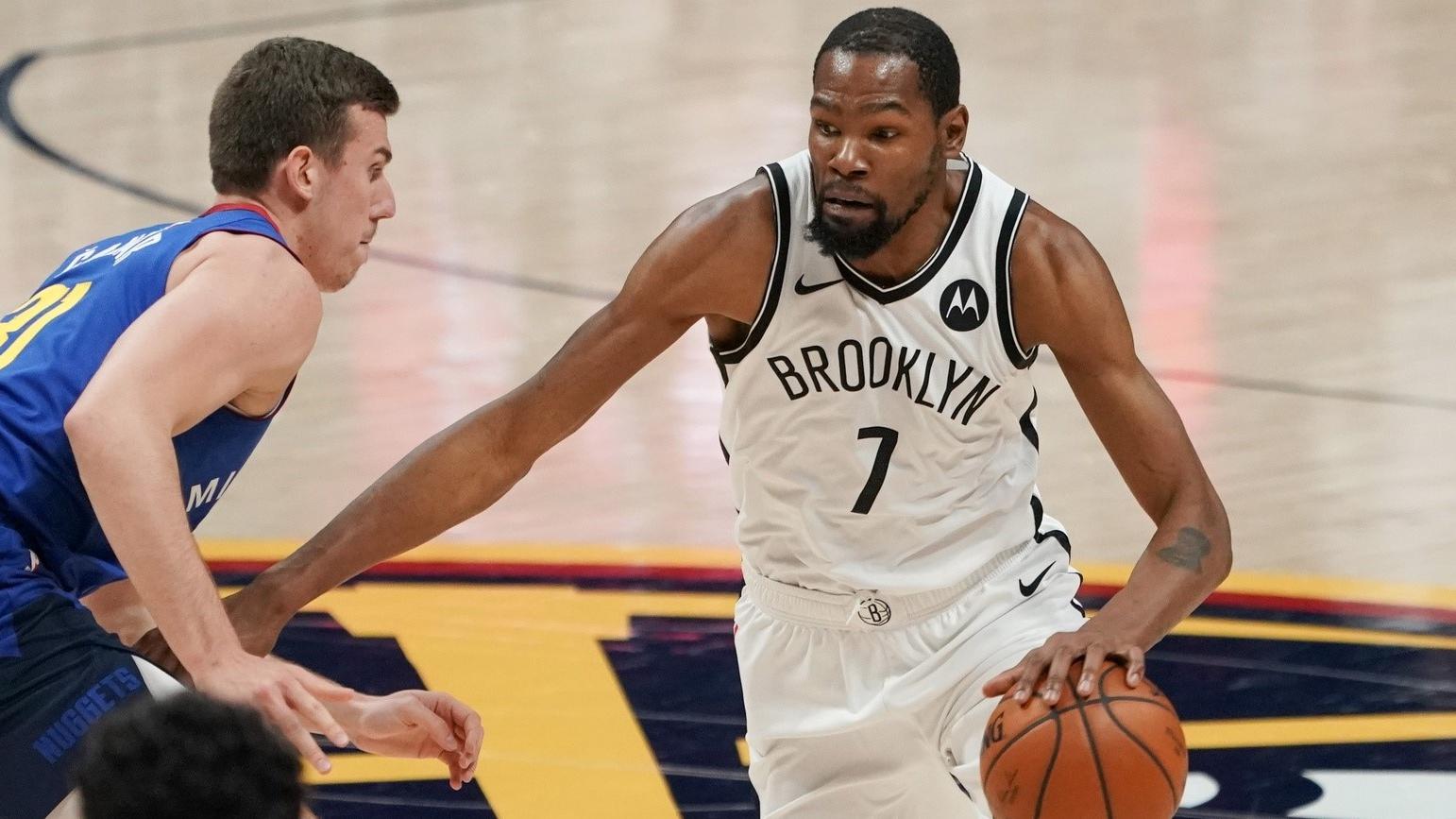 May 8, 2021; Denver, Colorado, USA; Brooklyn Nets forward Kevin Durant (7) drives against the Denver Nuggets during the third quarter at Ball Arena. / Troy Babbitt-USA TODAY Sports