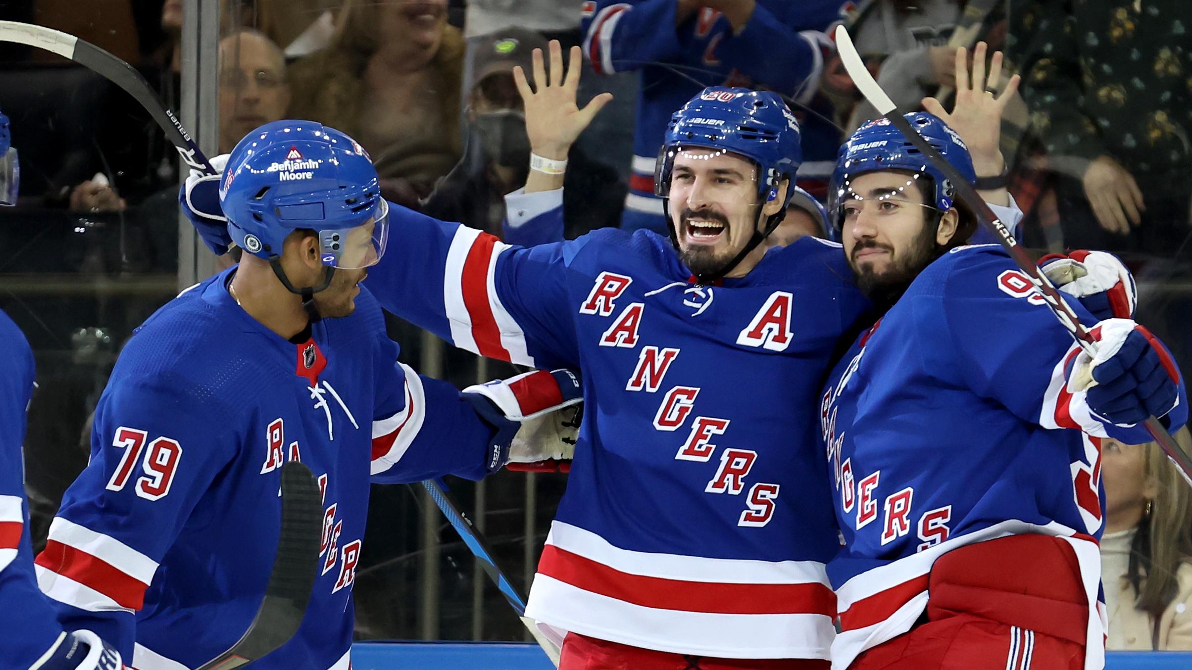 Mar 25, 2022; New York, New York, USA; New York Rangers left wing Chris Kreider (20) celebrates his goal against the Pittsburgh Penguins with defenseman Jacob Trouba (8) and defenseman K'Andre Miller (79) and center Mika Zibanejad (93) during the first period at Madison Square Garden. Mandatory Credit: Brad Penner-USA TODAY Sports / © Brad Penner-USA TODAY Sports