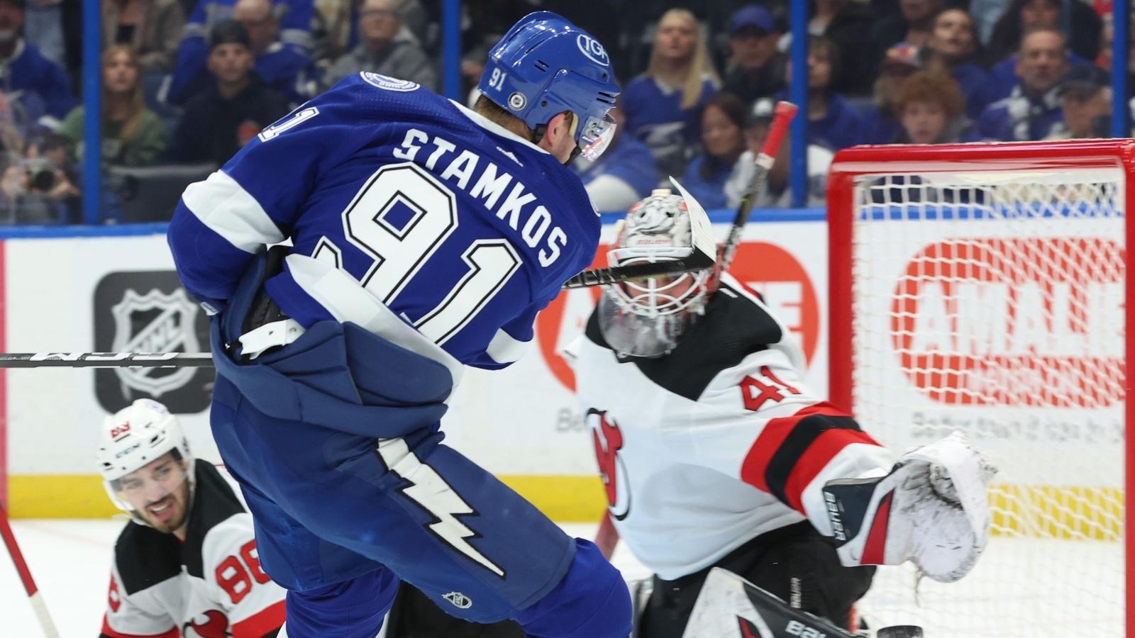 Tampa Bay Lightning center Steven Stamkos (91) shoots the puck as New Jersey Devils goaltender Vitek Vanecek (41) makes a save during the first period at Amalie Arena. / Kim Klement Neitzel-USA TODAY Sports