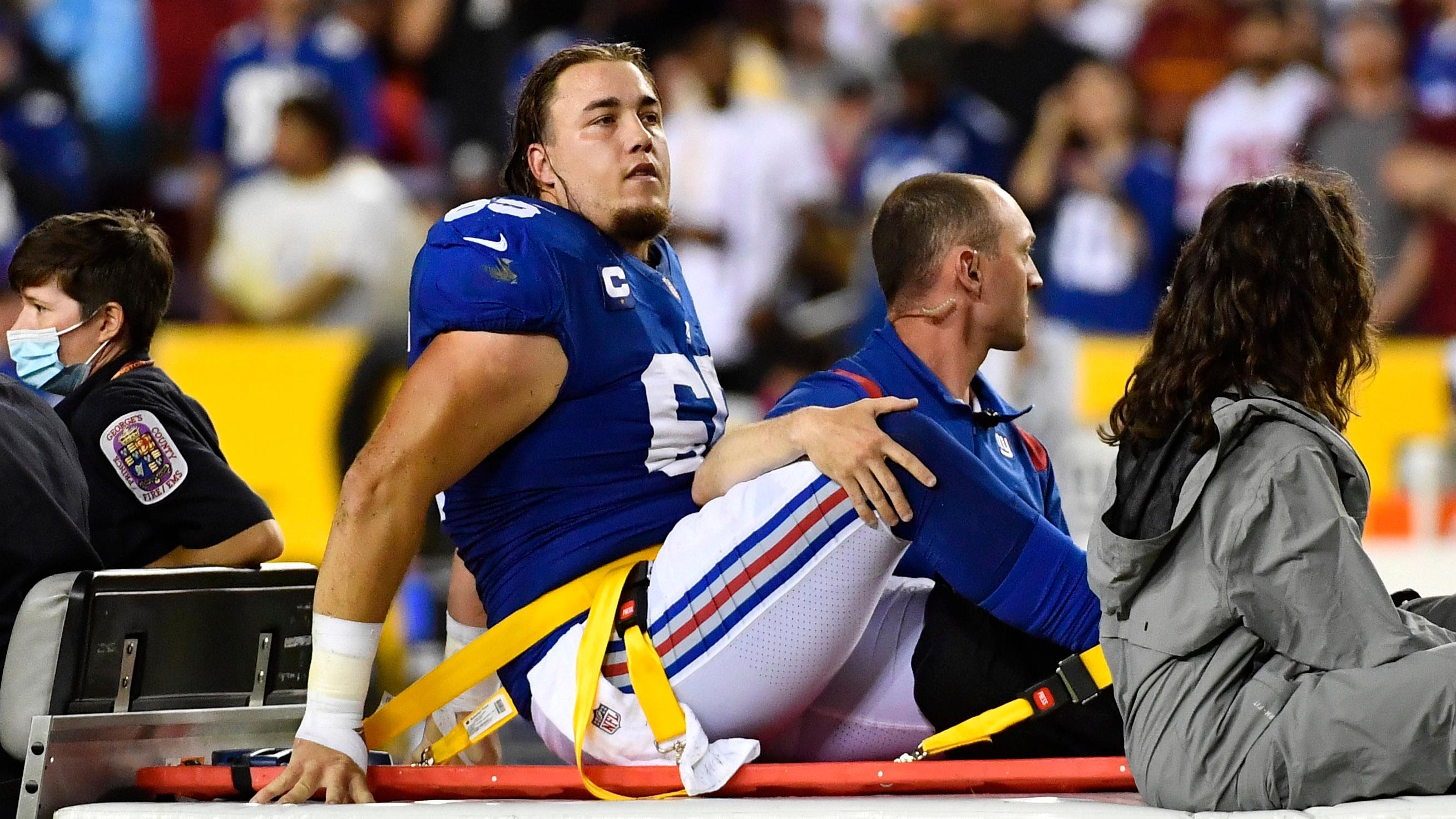 Sep 16, 2021; Landover, Maryland, USA; New York Giants center Nick Gates (65) reacts after suffering an apparent leg injury against the Washington Football Team during the first half at FedExField. / Brad Mills-USA TODAY Sports