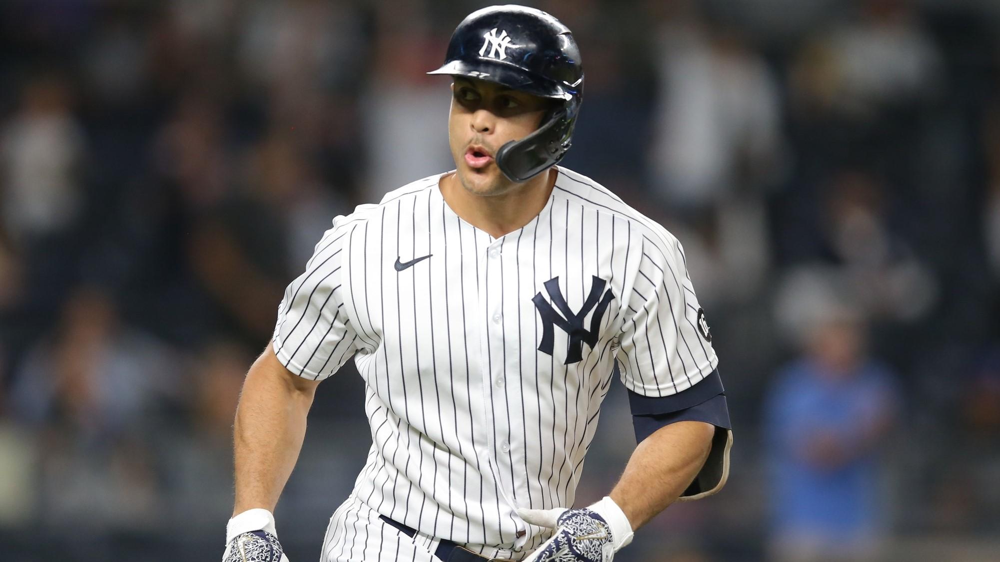 Sep 21, 2021; Bronx, New York, USA; New York Yankees right fielder Giancarlo Stanton (27) reacts as he rounds the bases after hitting a solo home run against the Texas Rangers during the third inning at Yankee Stadium. / Brad Penner-USA TODAY Sports