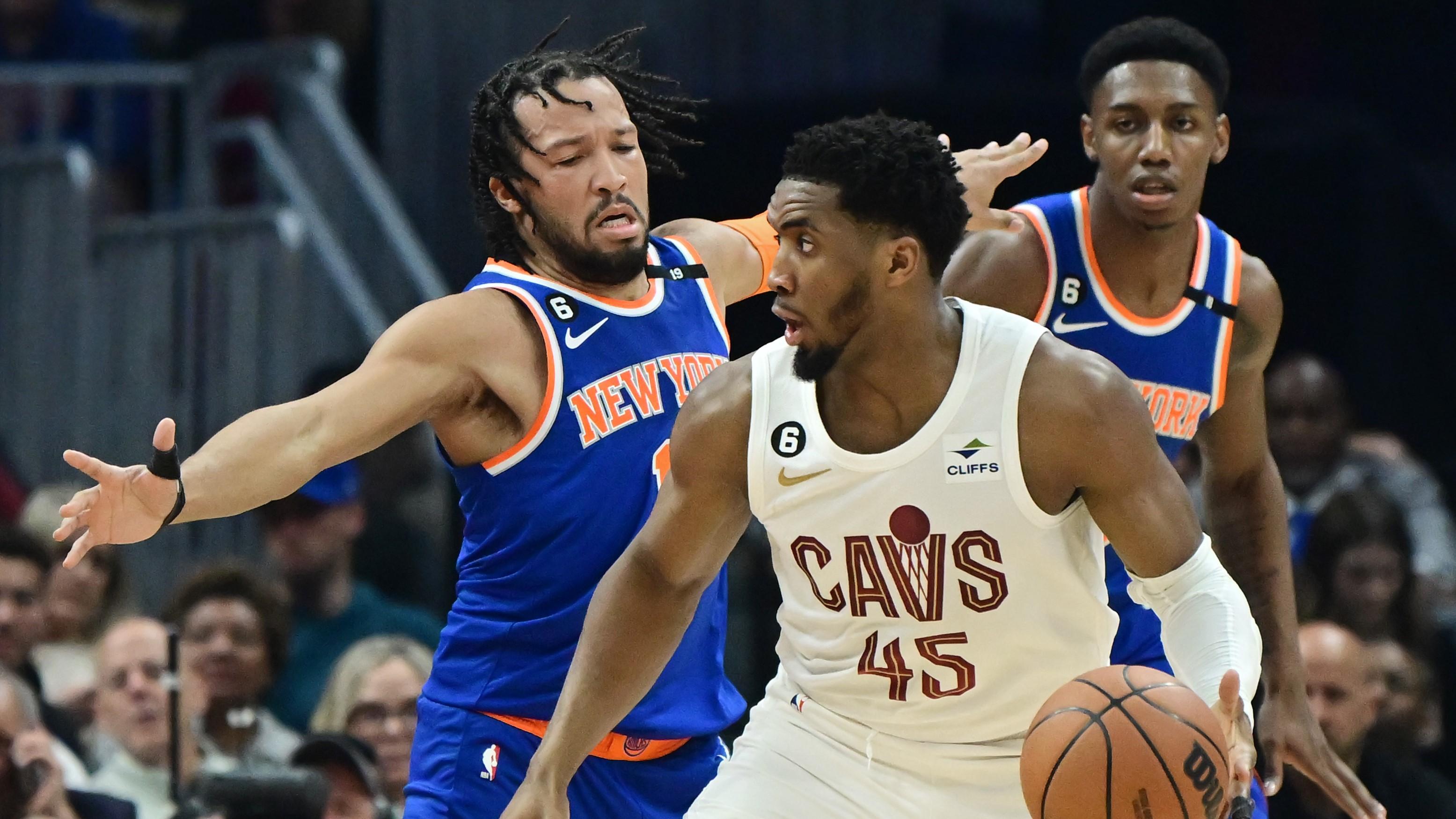Mar 31, 2023; Cleveland, Ohio, USA; Cleveland Cavaliers guard Donovan Mitchell (45) is defended by New York Knicks guard Jalen Brunson (11) during the first half at Rocket Mortgage FieldHouse. Mandatory Credit: Ken Blaze-USA TODAY Sports / © Ken Blaze-USA TODAY Sports