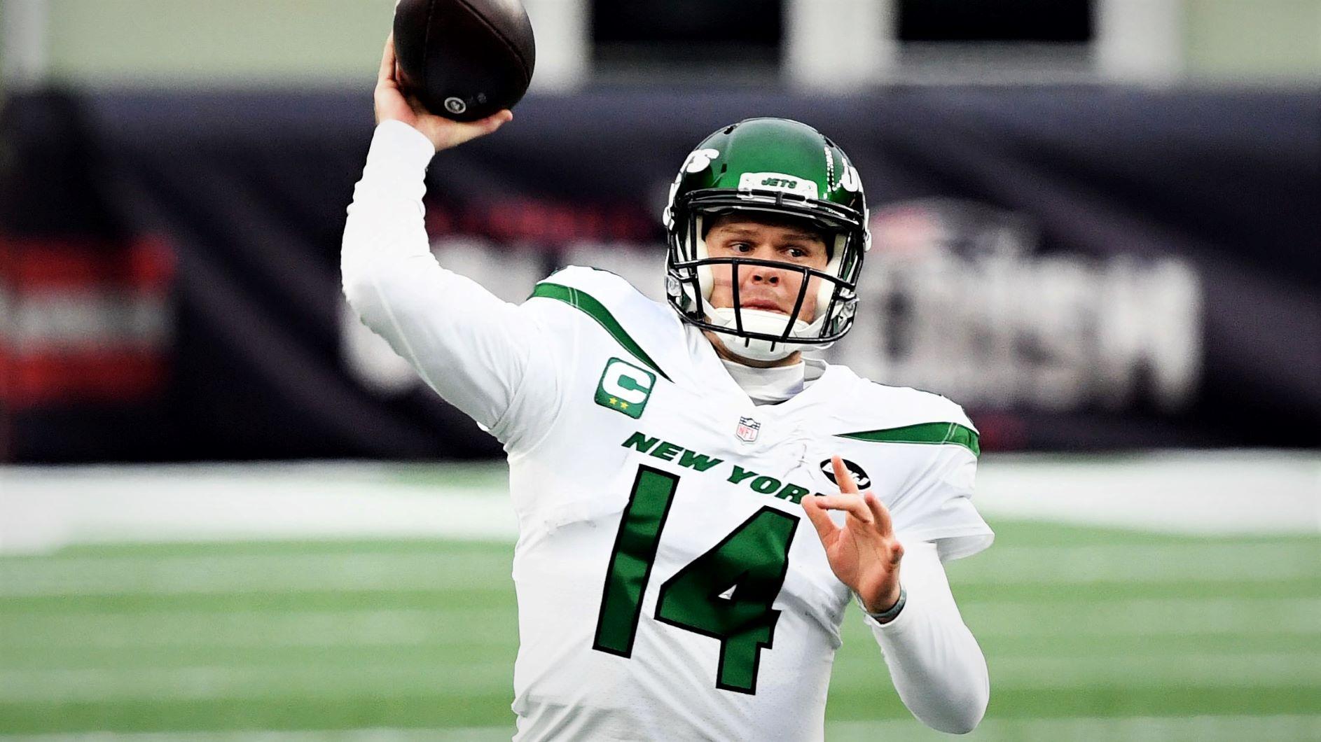 Jan 3, 2021; Foxborough, Massachusetts, USA; New York Jets quarterback Sam Darnold (14) throws the ball against the New England Patriots during the second quarter at Gillette Stadium. Mandatory Credit: Brian Fluharty-USA TODAY Sports / © Brian Fluharty-USA TODAY Sports