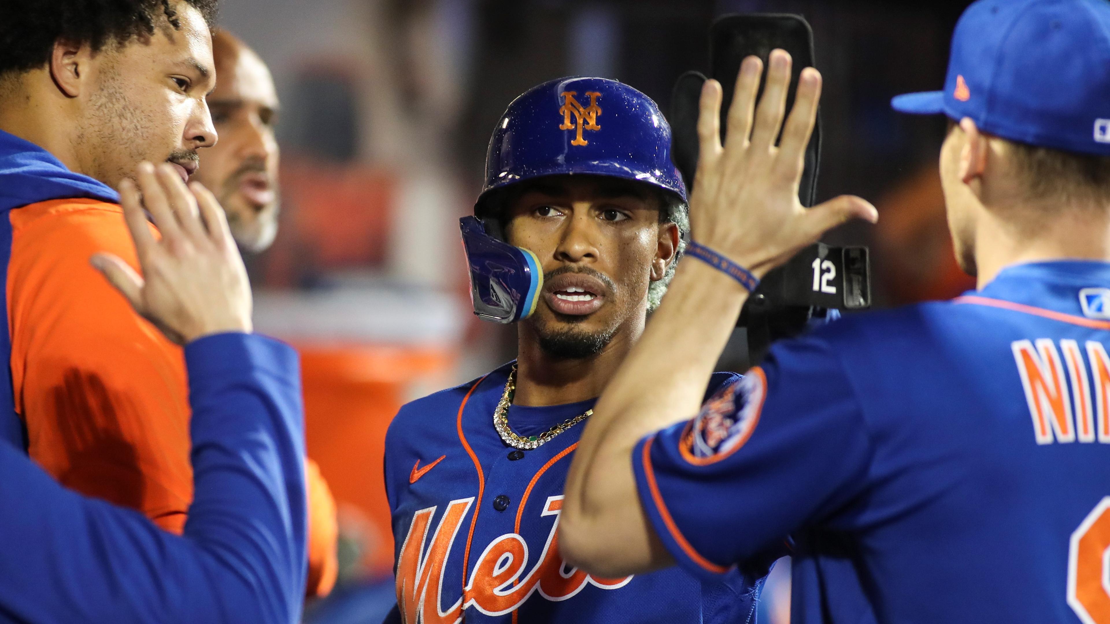 May 28, 2022; New York City, New York, USA; New York Mets shortstop Francisco Lindor (12) is greeted in the dugout after hitting a two run triple in the fifth inning at Citi Field. Mandatory Credit: Wendell Cruz-USA TODAY Sports / Wendell Cruz-USA TODAY Sports