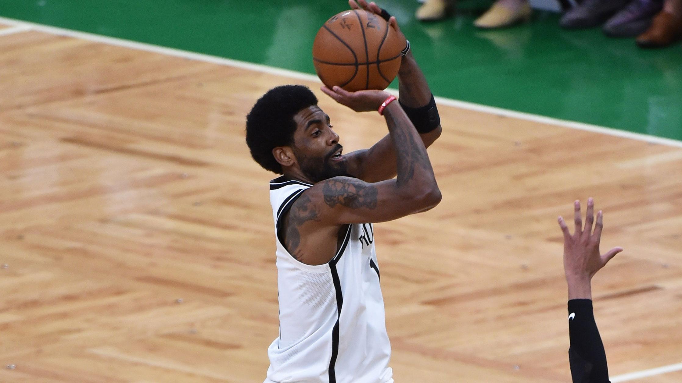May 28, 2021; Boston, Massachusetts, USA; Brooklyn Nets guard Kyrie Irving (11) shoots the ball over Boston Celtics guard Romeo Langford (45) during the second half during game three in the first round of the 2021 NBA Playoffs at TD Garden. / Bob DeChiara-USA TODAY Sports