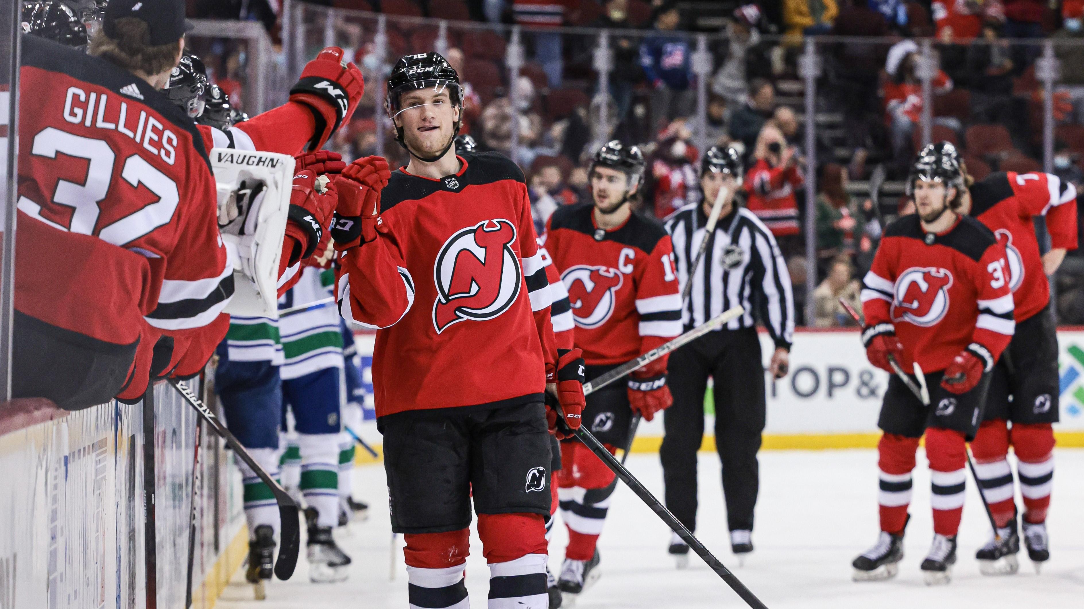 Feb 28, 2022; Newark, New Jersey, USA; New Jersey Devils center Dawson Mercer (18) celebrates his goal with teammates during the first period against the Vancouver Canucks at Prudential Center. / Vincent Carchietta-USA TODAY Sports