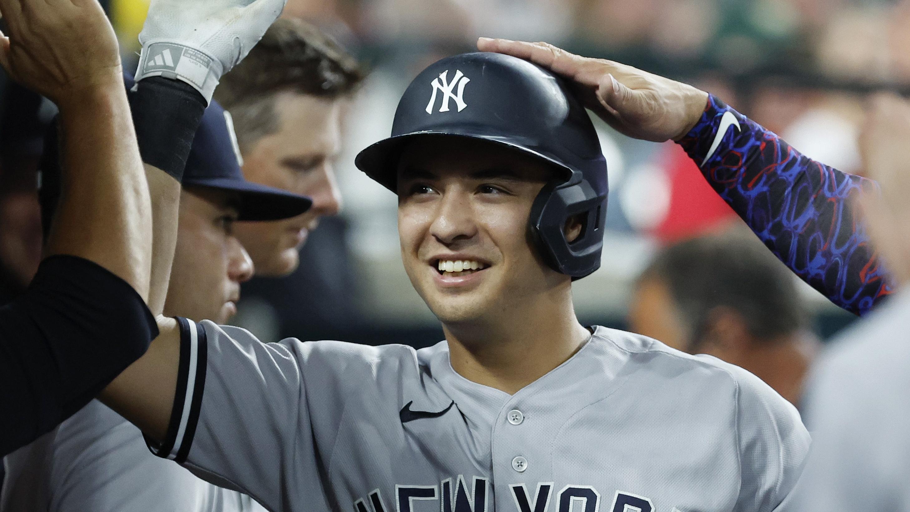 New York Yankees shortstop Anthony Volpe (11) celebrates with teammates after hitting a home run in the ninth inning against the Detroit Tigers at Comerica Park. / Rick Osentoski - USA TODAY Sports