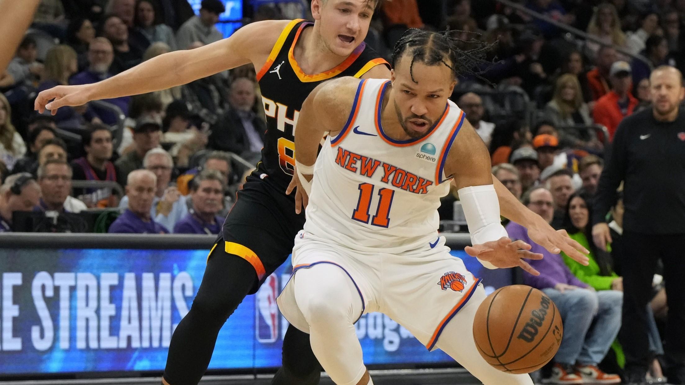 Dec 15, 2023; Phoenix, Arizona, USA; New York Knicks guard Jalen Brunson (11) drives on Phoenix Suns guard Grayson Allen (8) in the second half at Footprint Center. / Rick Scuteri-USA TODAY Sports