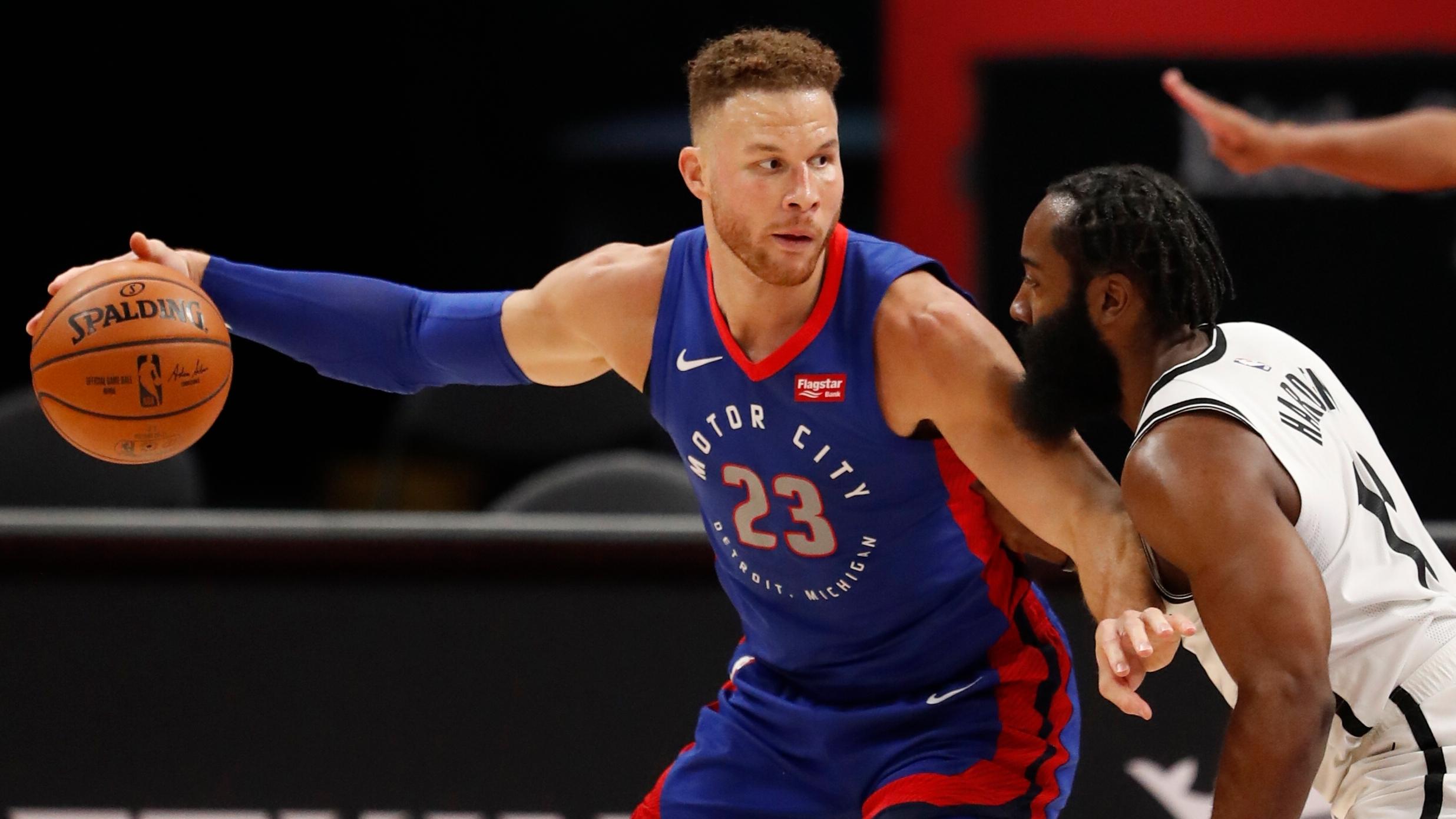 Feb 9, 2021; Detroit, Michigan, USA; Detroit Pistons forward Blake Griffin (23) controls the ball while defended by Brooklyn Nets guard James Harden (R) during the first quarter at Little Caesars Arena. / Raj Mehta-USA TODAY Sports
