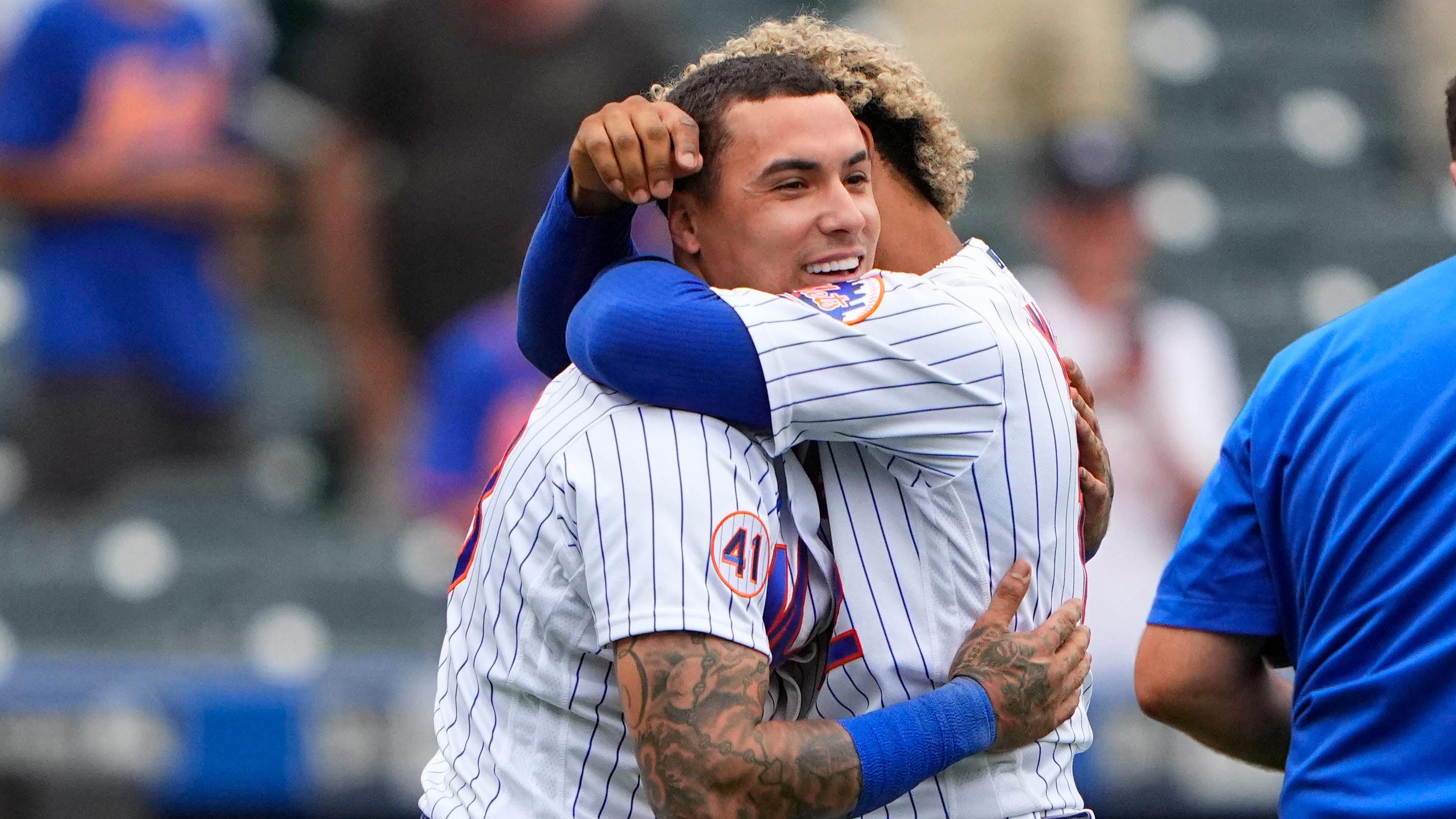 Aug 31, 2021; New York City, New York, USA; New York Mets shortstop Francisco Lindor (12) and New York Mets second baseman Javier Baez (23) embrace to celebrate the victory after the ninth inning against the Miami Marlins at Citi Field. / Gregory Fisher-USA TODAY Sports