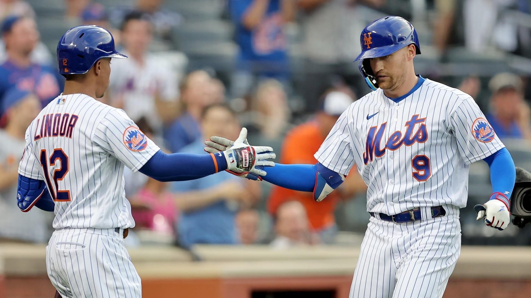 New York Mets left fielder Brandon Nimmo (9) celebrates his solo home run against the Pittsburgh Pirates with shortstop Francisco Lindor (12) during the first inning. / Brad Penner-USA TODAY Sports