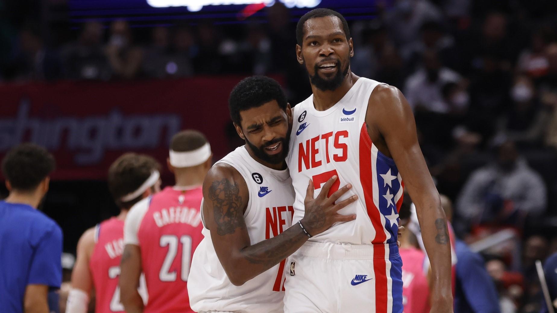 Dec 12, 2022; Washington, District of Columbia, USA; Brooklyn Nets guard Kyrie Irving (11) celebrates with Nets forward Kevin Durant (7) against the Washington Wizards in the fourth quarter at Capital One Arena. / Geoff Burke-USA TODAY Sports