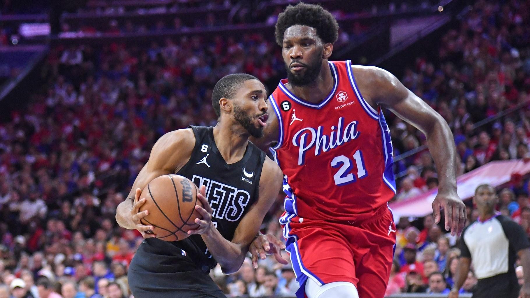 Apr 15, 2023; Philadelphia, Pennsylvania, USA; Brooklyn Nets forward Mikal Bridges (1) drives to the basket against Philadelphia 76ers center Joel Embiid (21) during the second quarter of game one of the 2023 NBA playoffs at Wells Fargo Center. / Eric Hartline-USA TODAY Sports
