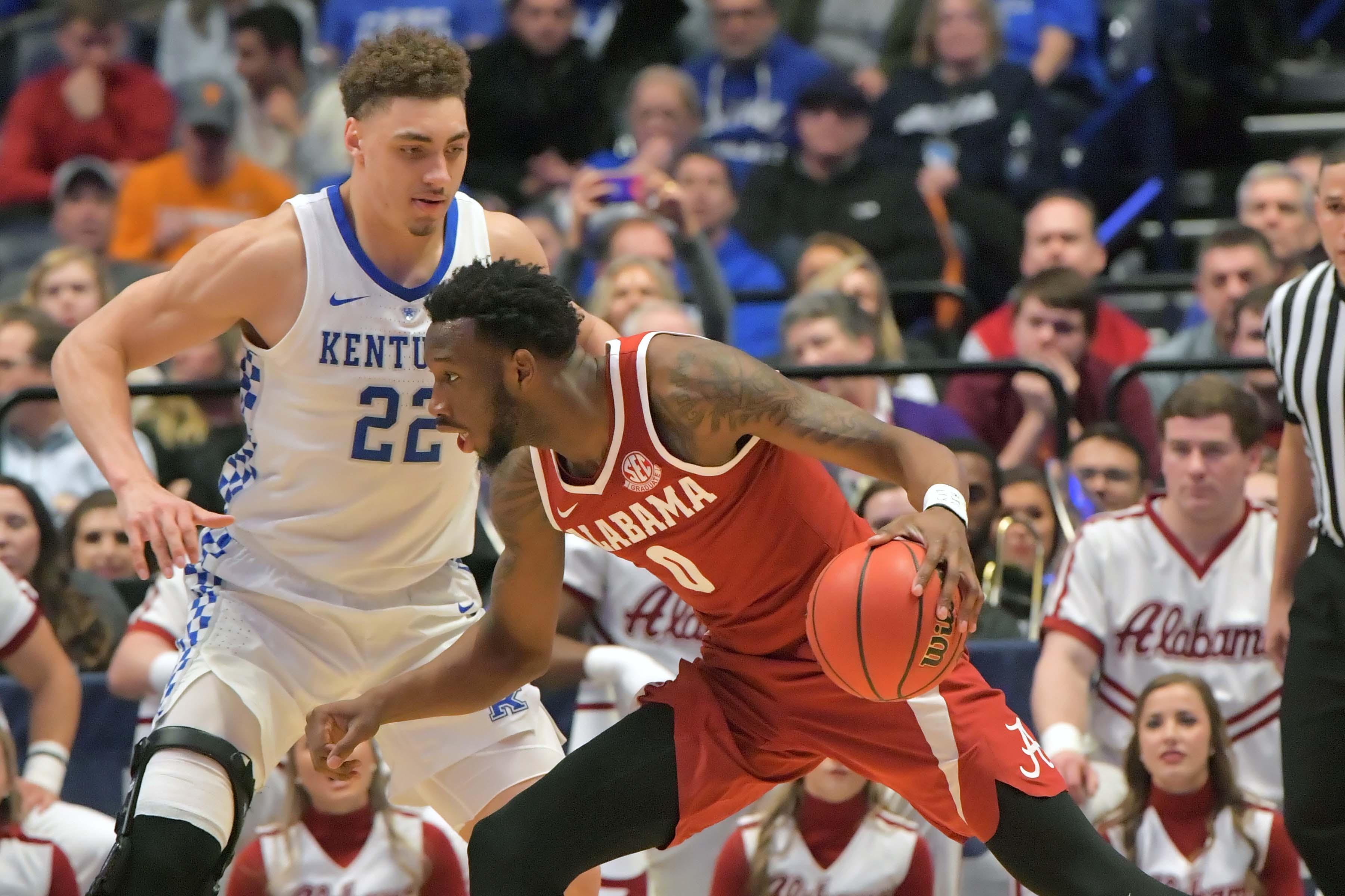 Mar 15, 2019; Nashville, TN, USA; Alabama Crimson Tide forward Donta Hall (0) controls the ball against Kentucky Wildcats forward Reid Travis (22) during the second half of game nine in the SEC conference tournament at Bridgestone Arena. Kentucky won 73-55. Mandatory Credit: Jim Brown-USA TODAY Sports / Jim Brown/USA TODAY Sports