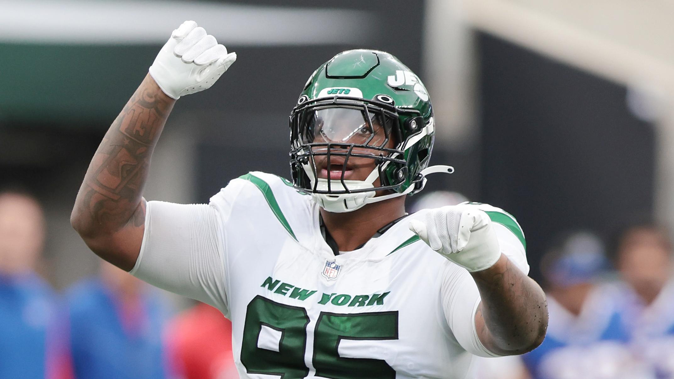 Nov 6, 2022; East Rutherford, New Jersey, USA; New York Jets defensive tackle Quinnen Williams (95) celebrates a defensive stop against the Buffalo Bills during the second half at MetLife Stadium. Mandatory Credit: Vincent Carchietta-USA TODAY Sports / © Vincent Carchietta-USA TODAY Sports