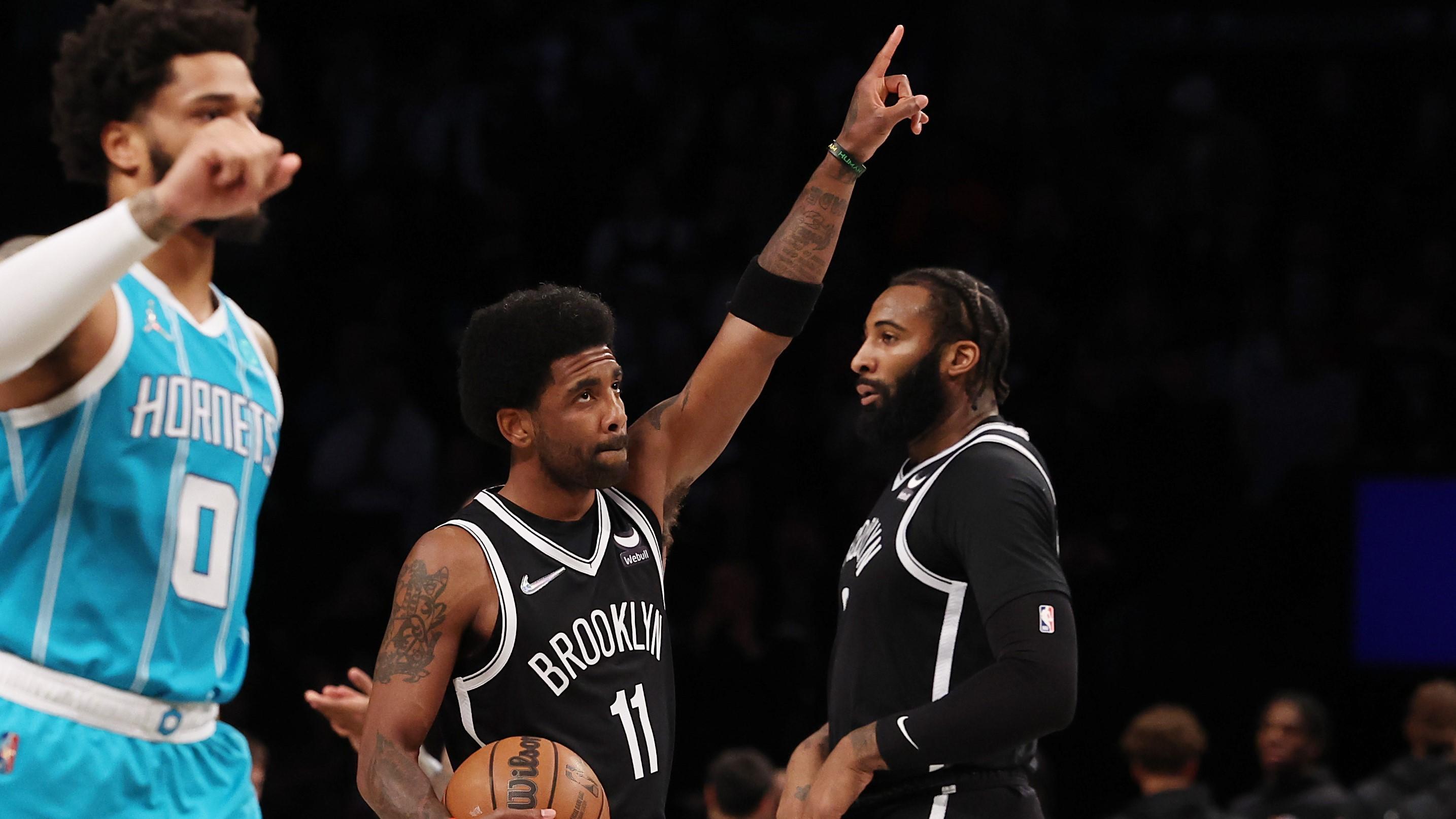 Mar 27, 2022; Brooklyn, New York, USA; Brooklyn Nets guard Kyrie Irving (11) gestures towards the fans before the game against the Charlotte Hornets at Barclays Center. Mandatory Credit: Vincent Carchietta-USA TODAY Sports / Vincent Carchietta-USA TODAY Sports