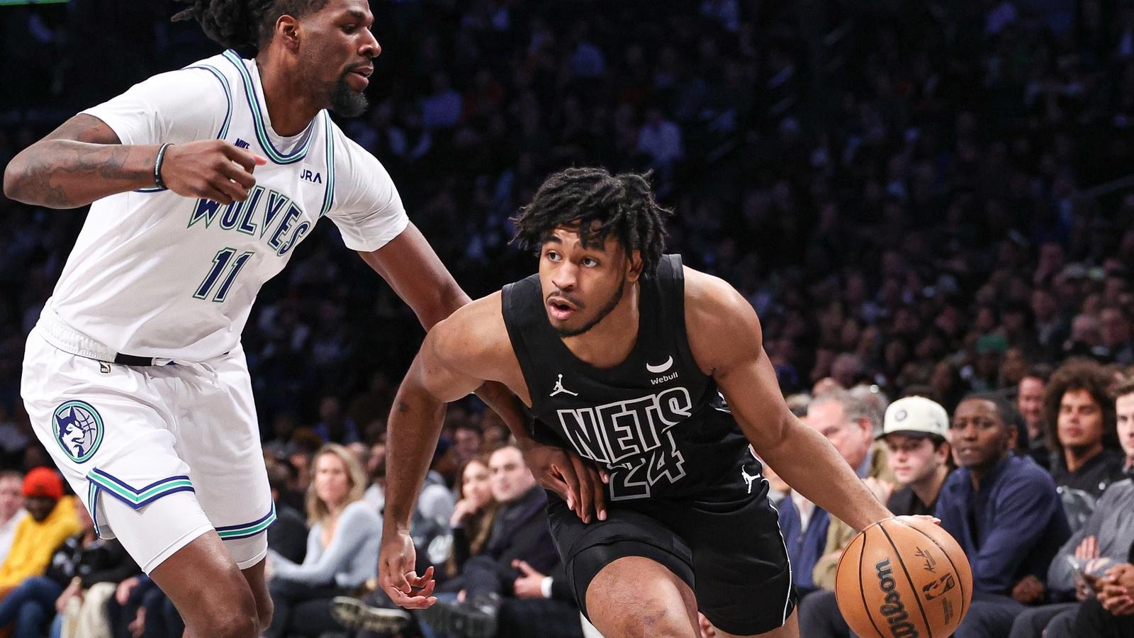 Brooklyn Nets guard Cam Thomas (24) dribbles toward the basket while defended by Minnesota Timberwolves center Naz Reid (11) during the first quarter at Barclays Center. / Vincent Carchietta-USA TODAY Sports