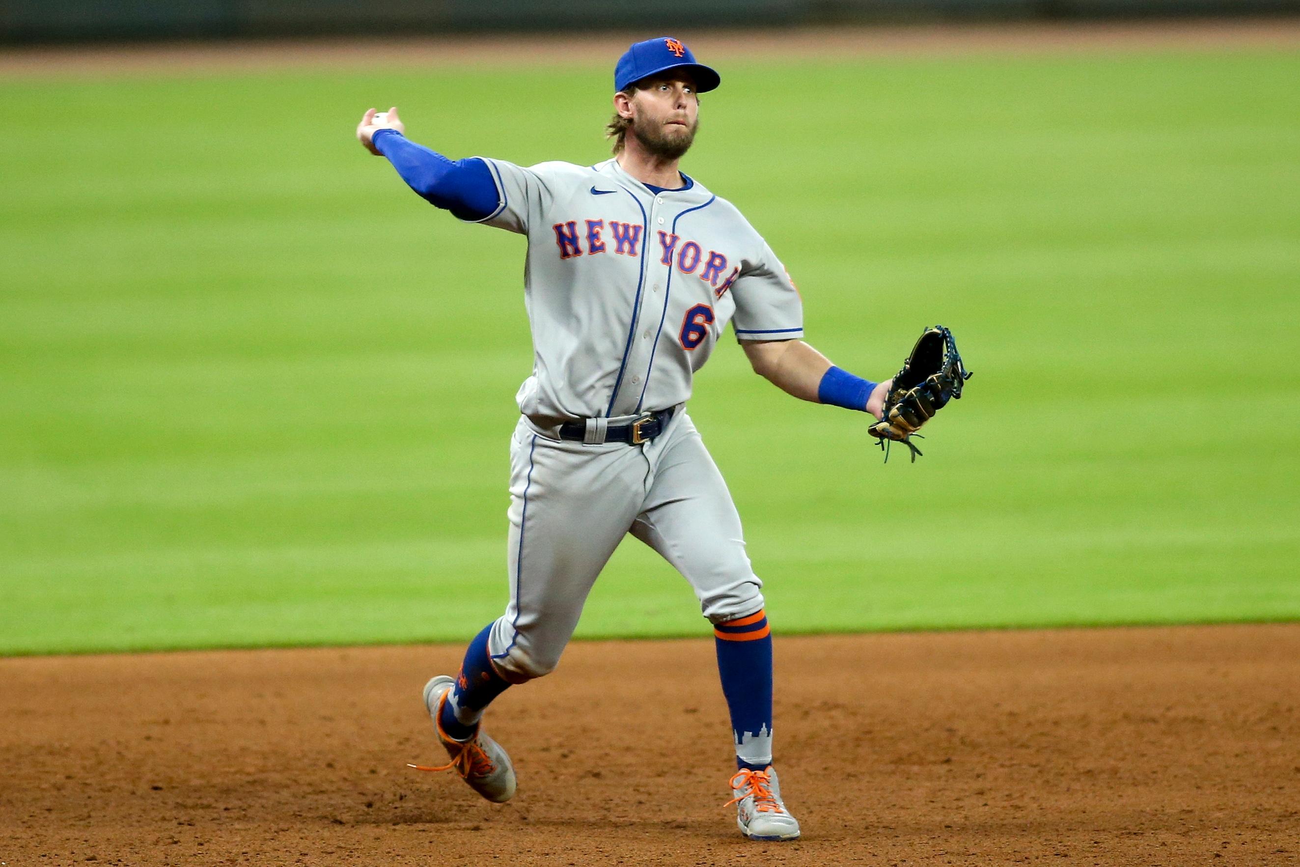 Aug 1, 2020; Atlanta, Georgia, USA; New York Mets third baseman Jeff McNeil (6) throws a runner out at first against the Atlanta Braves in the eighth inning at Truist Park. Mandatory Credit: Brett Davis-USA TODAY Sports / © Brett Davis-USA TODAY Sports