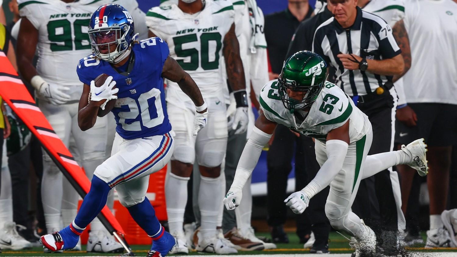 Aug 26, 2023; East Rutherford, New Jersey, USA; New York Giants running back Eric Gray (20) runs with the ball against the New York Jets during the first half at MetLife Stadium. / Ed Mulholland-USA TODAY Sports