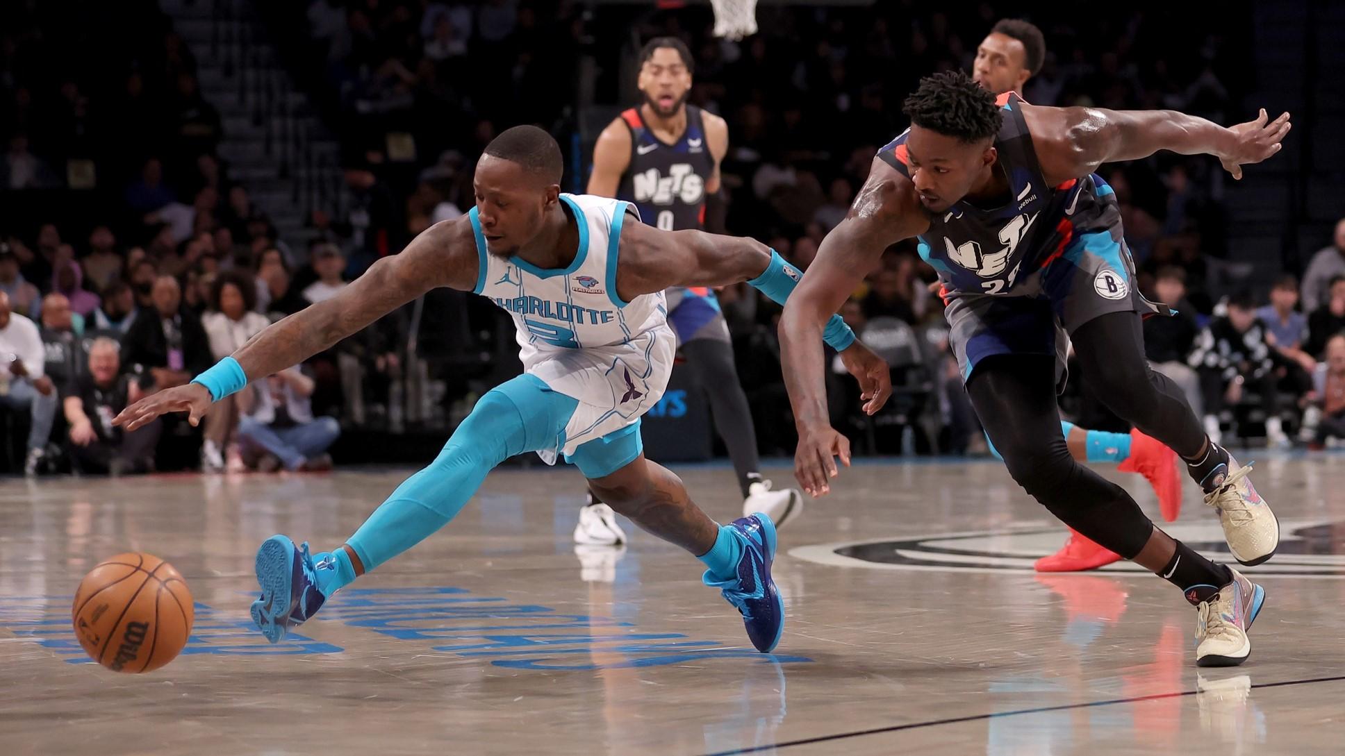 Nov 30, 2023; Brooklyn, New York, USA; Charlotte Hornets guard Terry Rozier (3) and Brooklyn Nets forward Dorian Finney-Smith (28) fight for the ball during the first quarter at Barclays Center. / Brad Penner-USA TODAY Sports