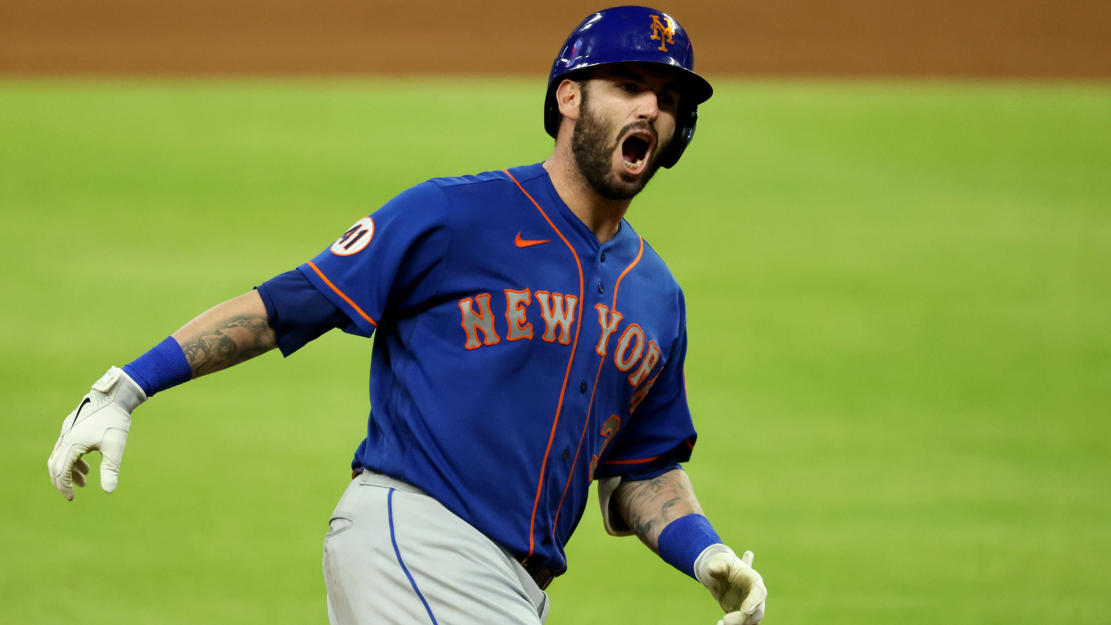 May 18, 2021; Atlanta, Georgia, USA; New York Mets catcher Tomas Nido (3) reacts after hitting a solo home run during the ninth inning against the Atlanta Braves at Truist Park. / Jason Getz-USA TODAY Sports