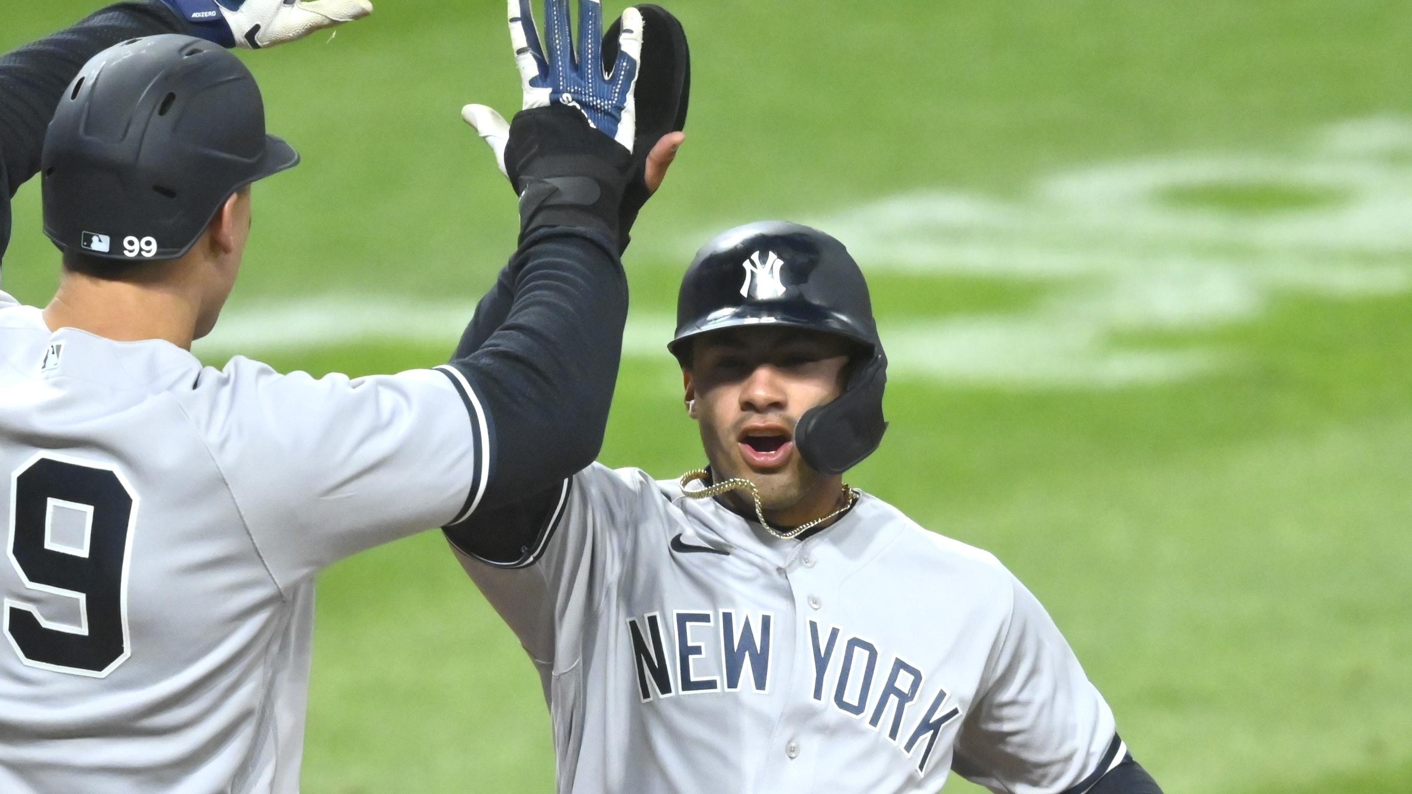 Apr 22, 2021; Cleveland, Ohio, USA; New York Yankees designated hitter Aaron Judge (99) and shortstop Gleyber Torres (25) celebrate after scoring in the seventh inning against the Cleveland Indians at Progressive Field. Mandatory Credit: David Richard-USA TODAY Sports / © David Richard-USA TODAY Sports