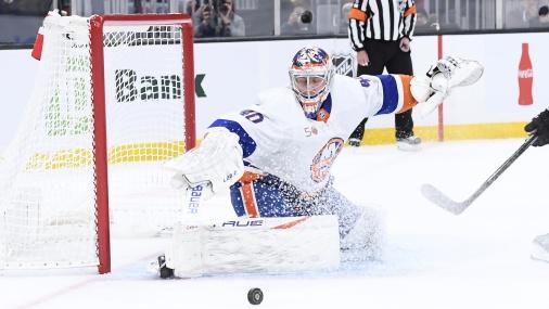 New York Islanders goaltender Semyon Varlamov (40) makes a pad save while Boston Bruins center Trent Frederic (11) looks on during the first period at TD Garden / Bob DeChiara - USA TODAY Sports