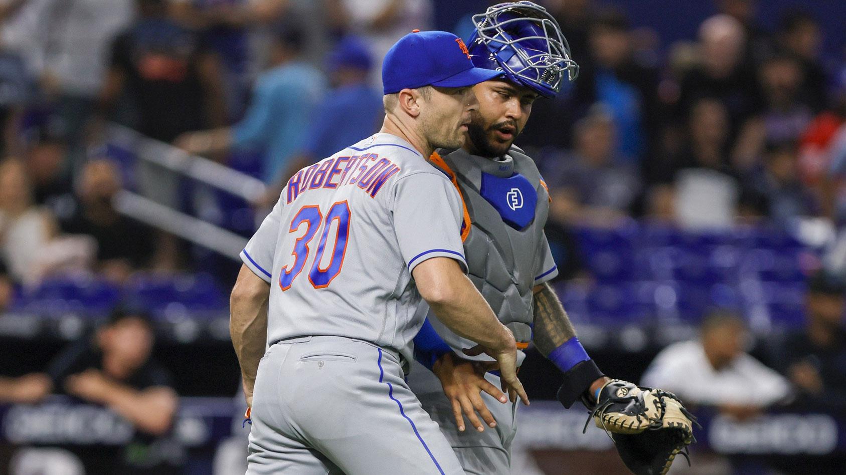 Mar 30, 2023; Miami, Florida, USA; New York Mets relief pitcher David Robertson (30) celebrates with catcher Omar Narvaez (2) after winning the game against the Miami Marlins at loanDepot Park. / Sam Navarro-USA TODAY Sports