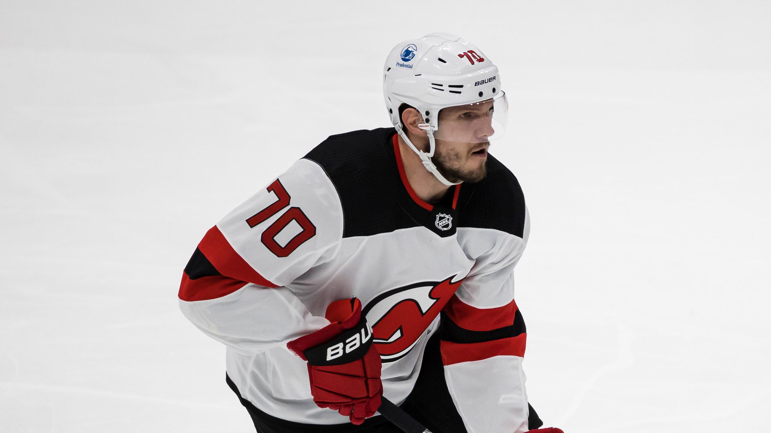 Mar 26, 2021; Washington, District of Columbia, USA; New Jersey Devils defenseman Dmitry Kulikov (70) skates with the puck against the Washington Capitals during the first period at Capital One Arena. / Scott Taetsch-USA TODAY Sports