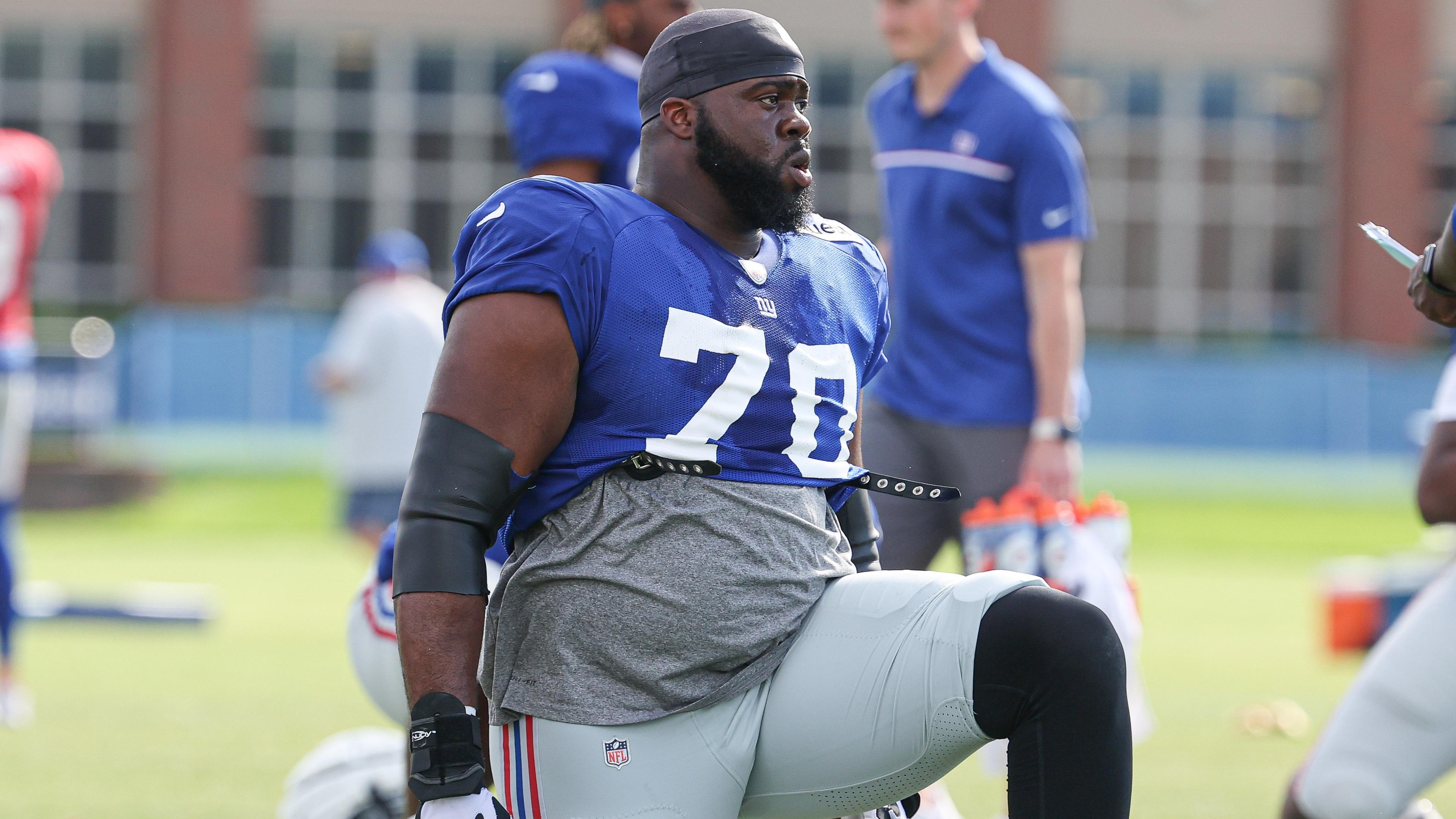 New York Giants offensive tackle Korey Cunningham (70) stretches during training camp at the Quest Diagnostics Training Facility / Vincent Carchietta - USA TODAY Sports