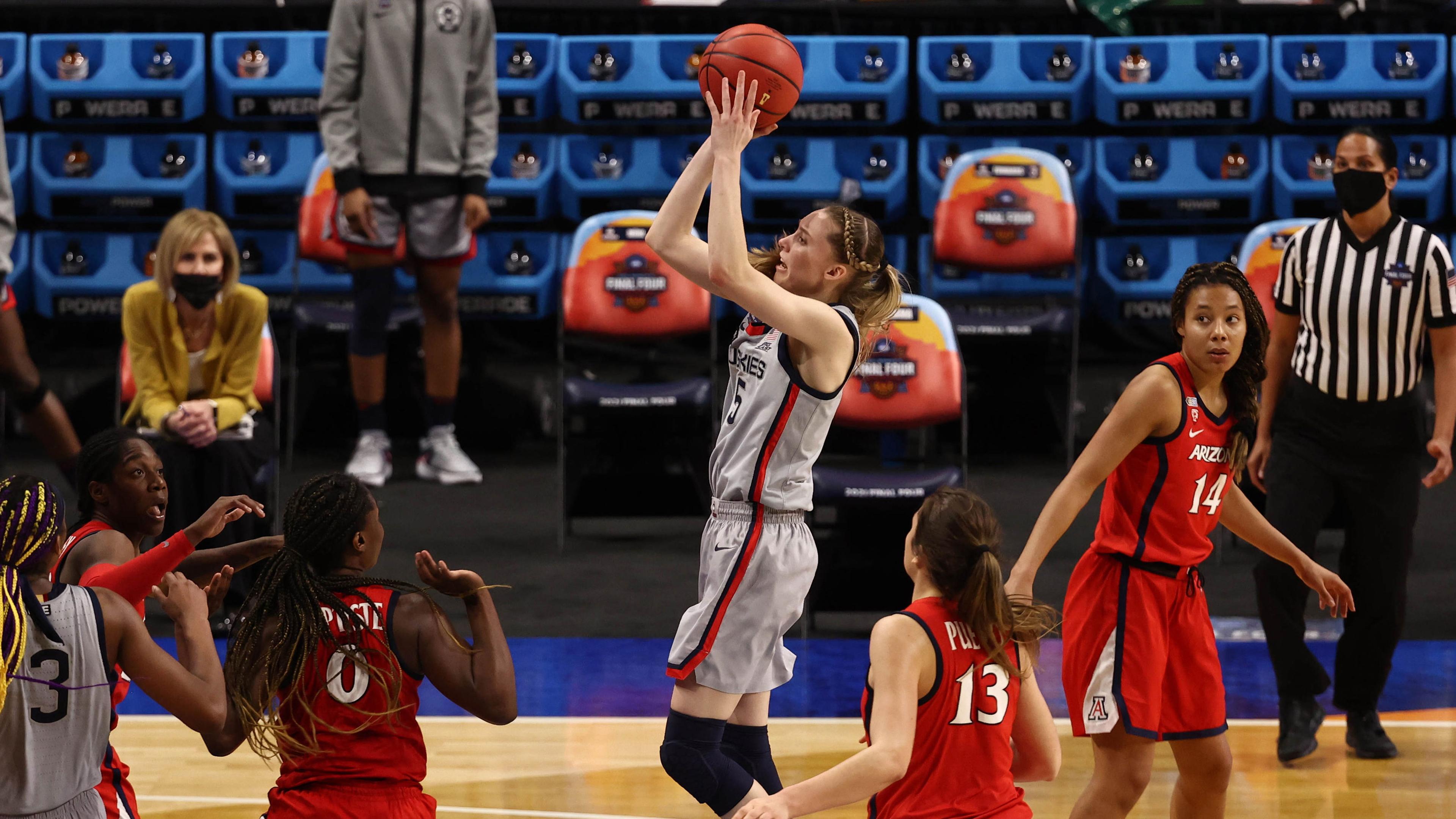 Apr 2, 2021; San Antonio, Texas, USA; UConn Huskies guard Paige Bueckers (5) shoots the ball over Arizona Wildcats forward Trinity Baptiste (0) during the second half in the national semifinals of the women's Final Four of the 2021 NCAA Tournament at Alamodome. / Troy Taormina-USA TODAY Sports